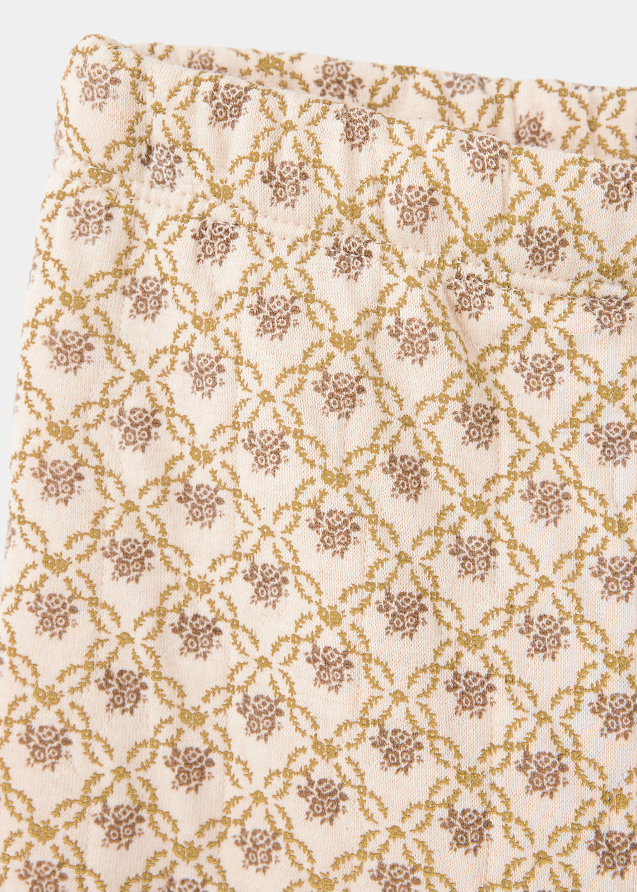 Close-up of pale pink floral joggers with an elasticated waistband and brown and olive lattice pattern., Beige. Ref: 37097935-00.