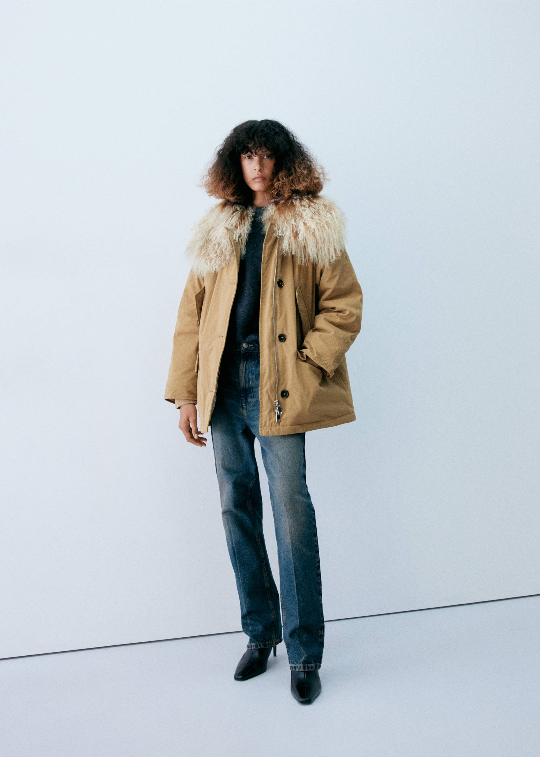 Camel parka with a cream faux-fur collar, worn with blue jeans and black boots., Beige. Ref: 37098264-00.
