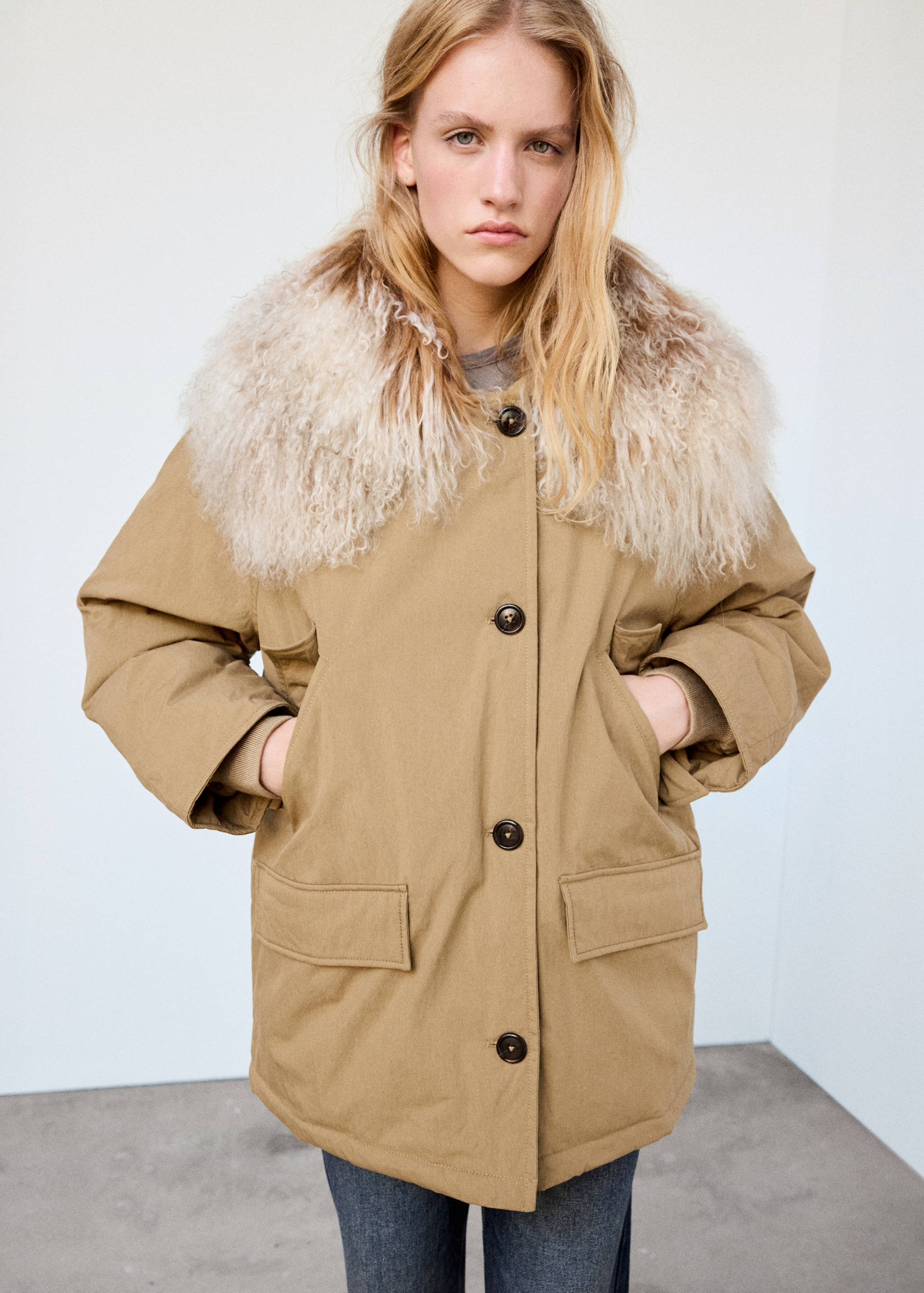 Camel parka with a classic collar, front buttons, and flap pockets