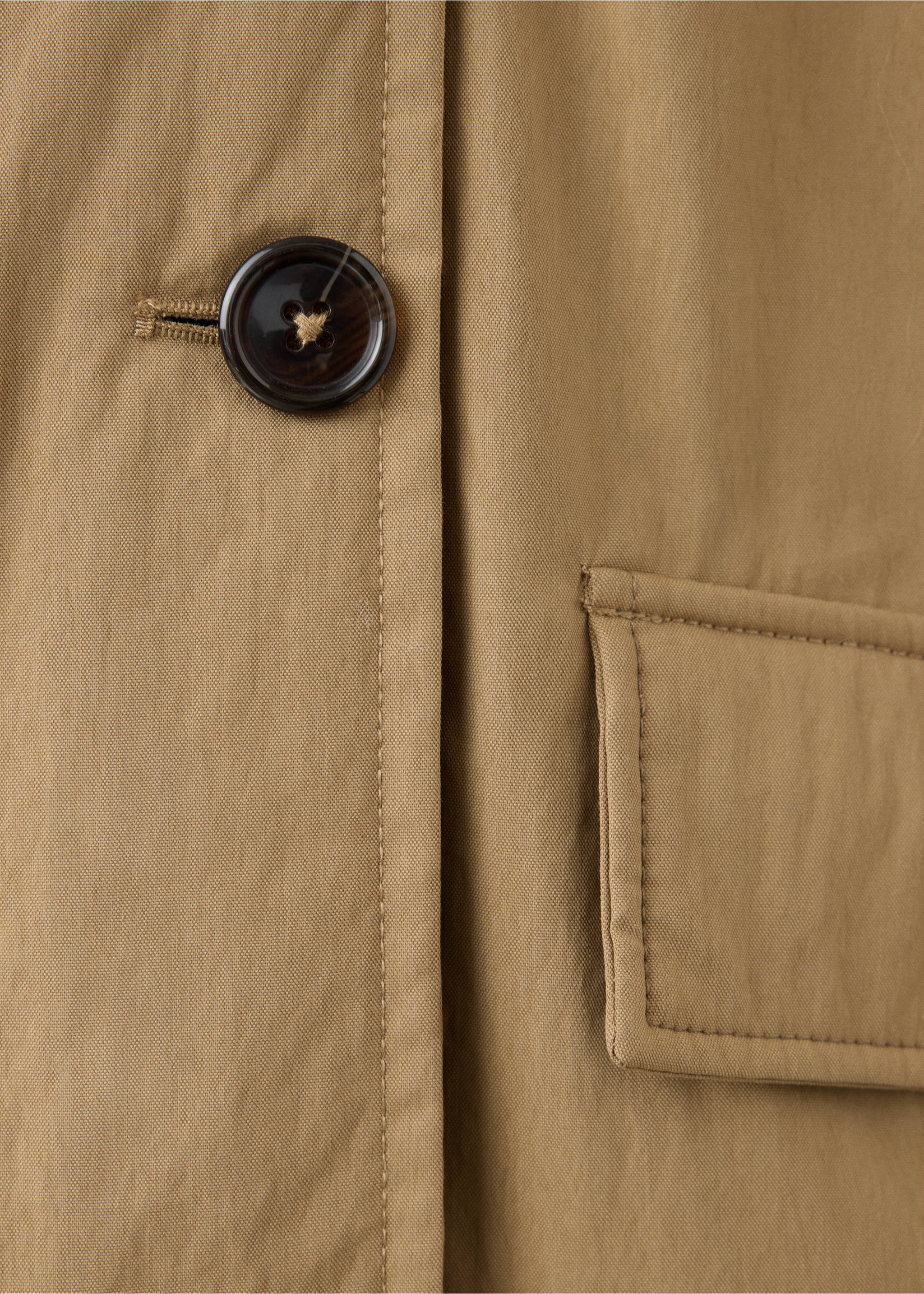 Close-up of brown parka showing button and pocket detail, Beige. Ref: 37098264-00.