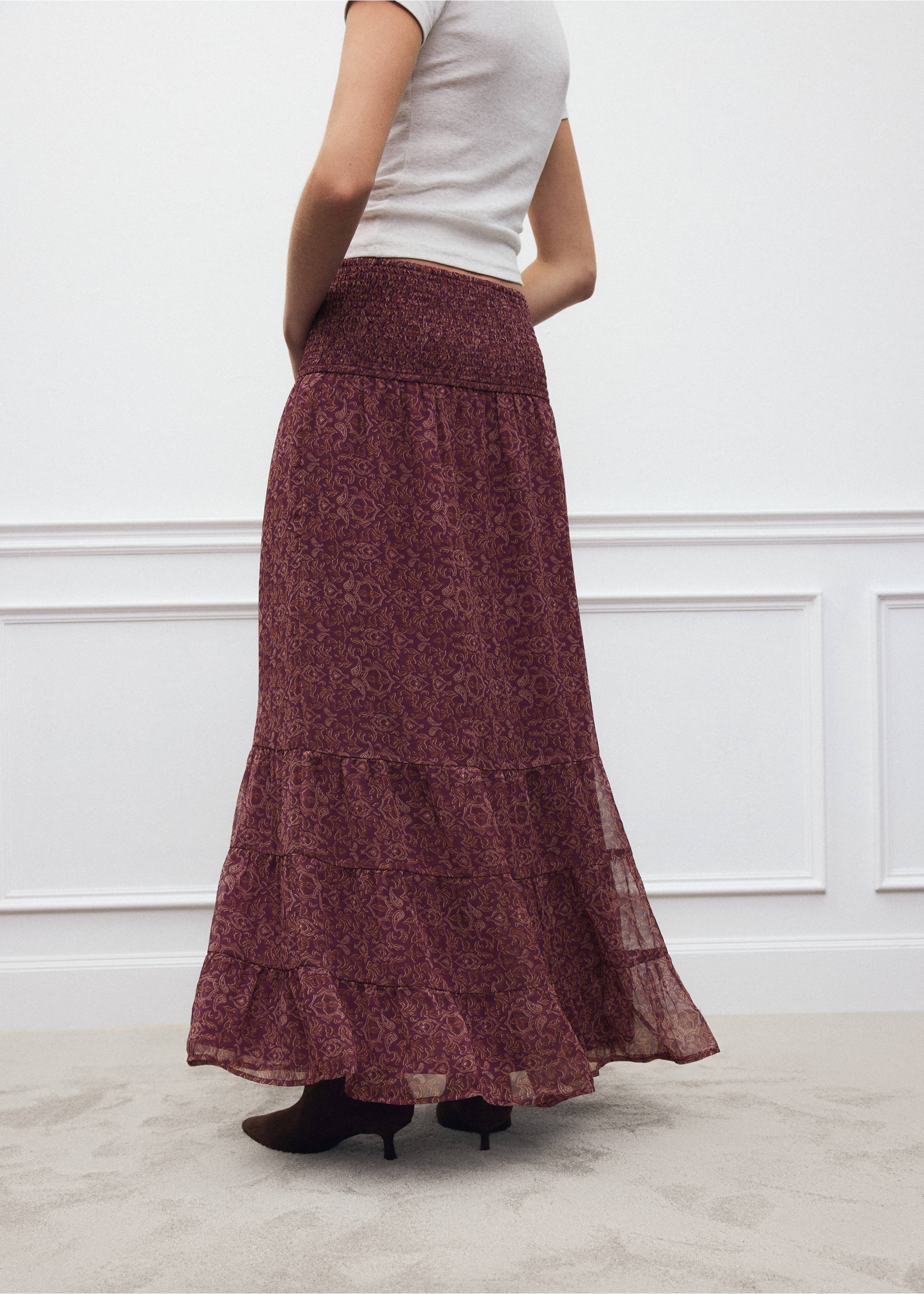 Burgundy patterned long tiered skirt with a smocked waistband, viewed from the back., Pink. Ref: 37098276-00.