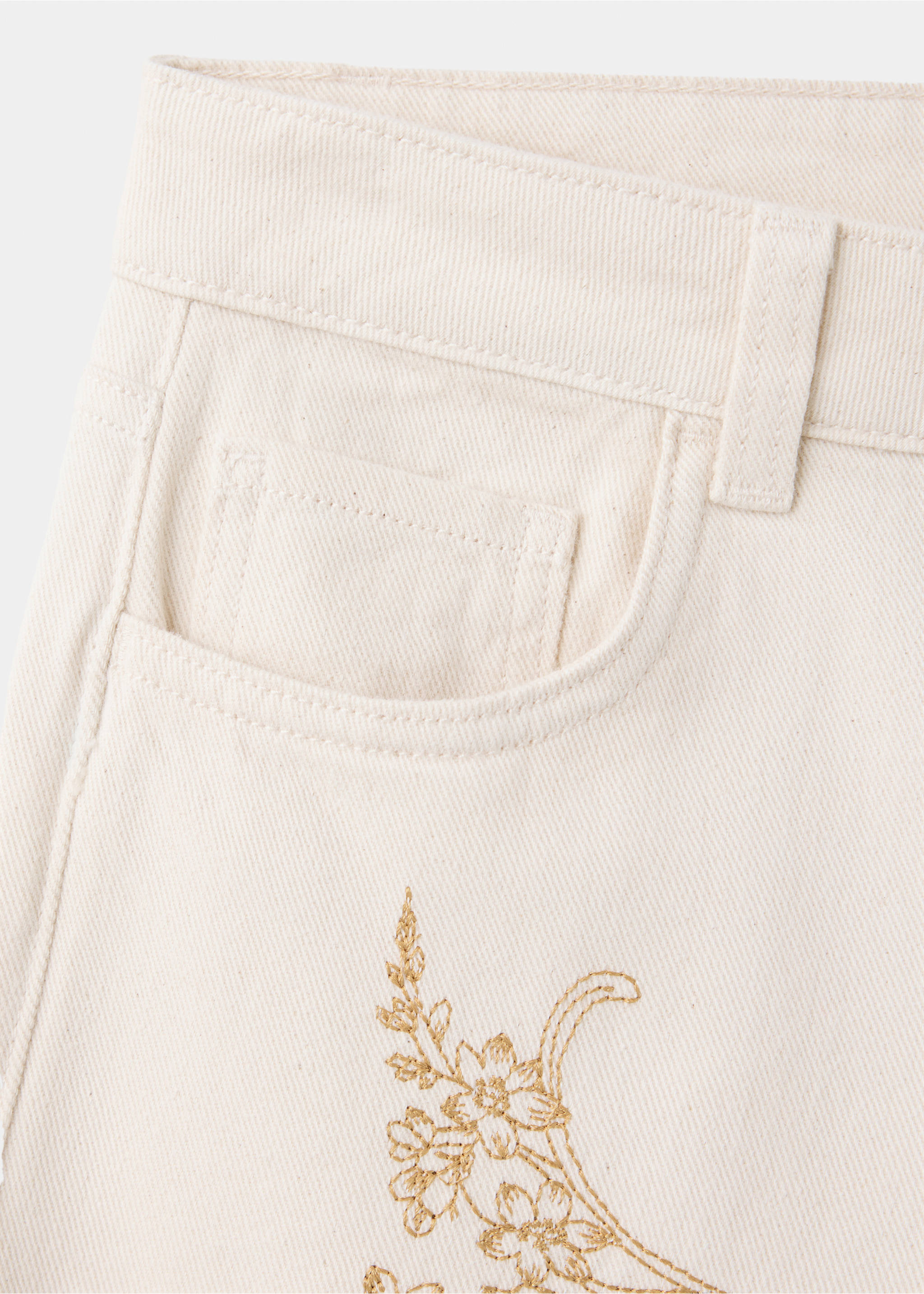 Close-up of off-white denim trousers with gold floral embroidery., Beige. Ref: 37098280-00.
