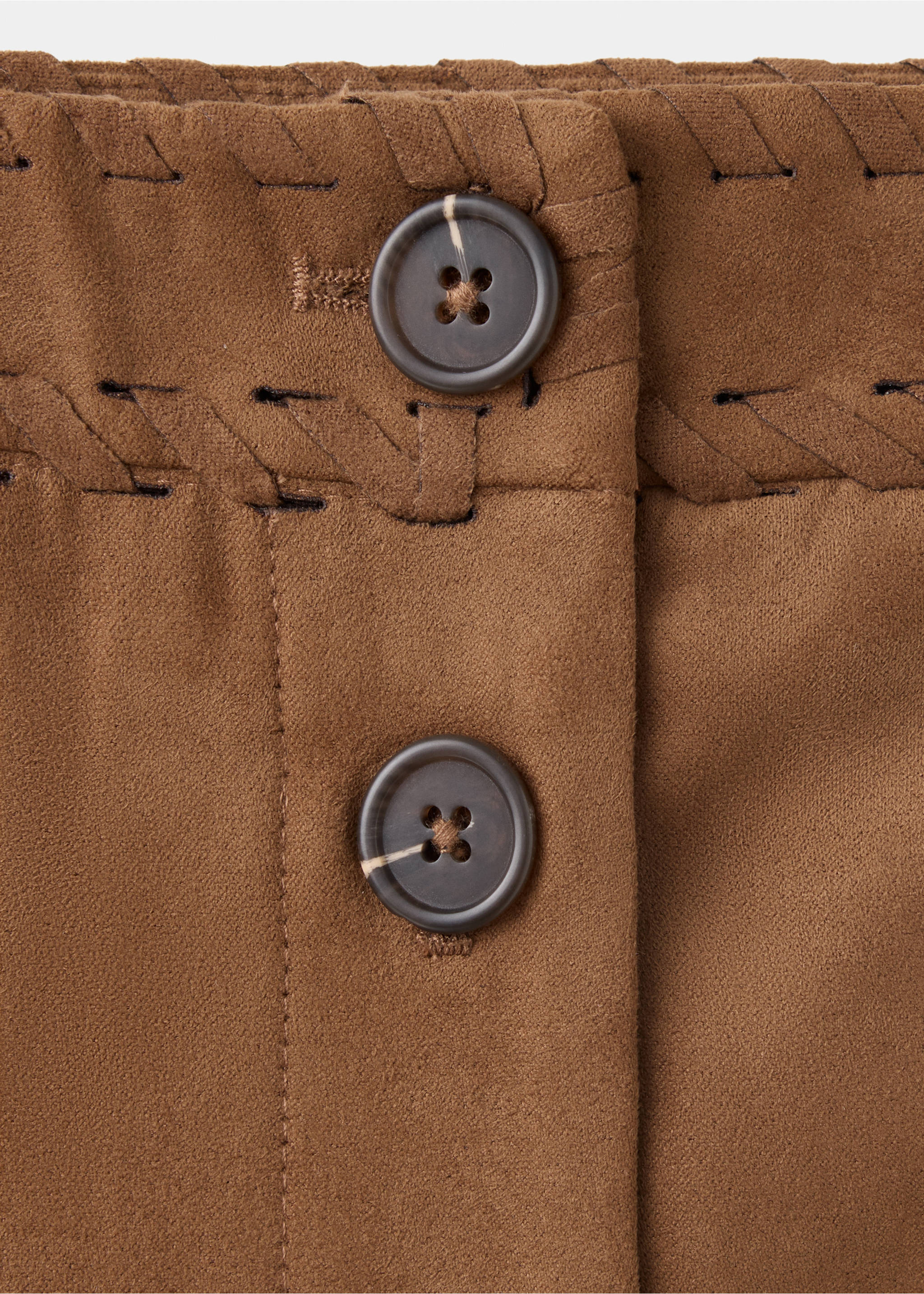 Close-up of a brown skirt showing whipstitch details and horn-effect buttons, Brown. Ref: 37098635-00.