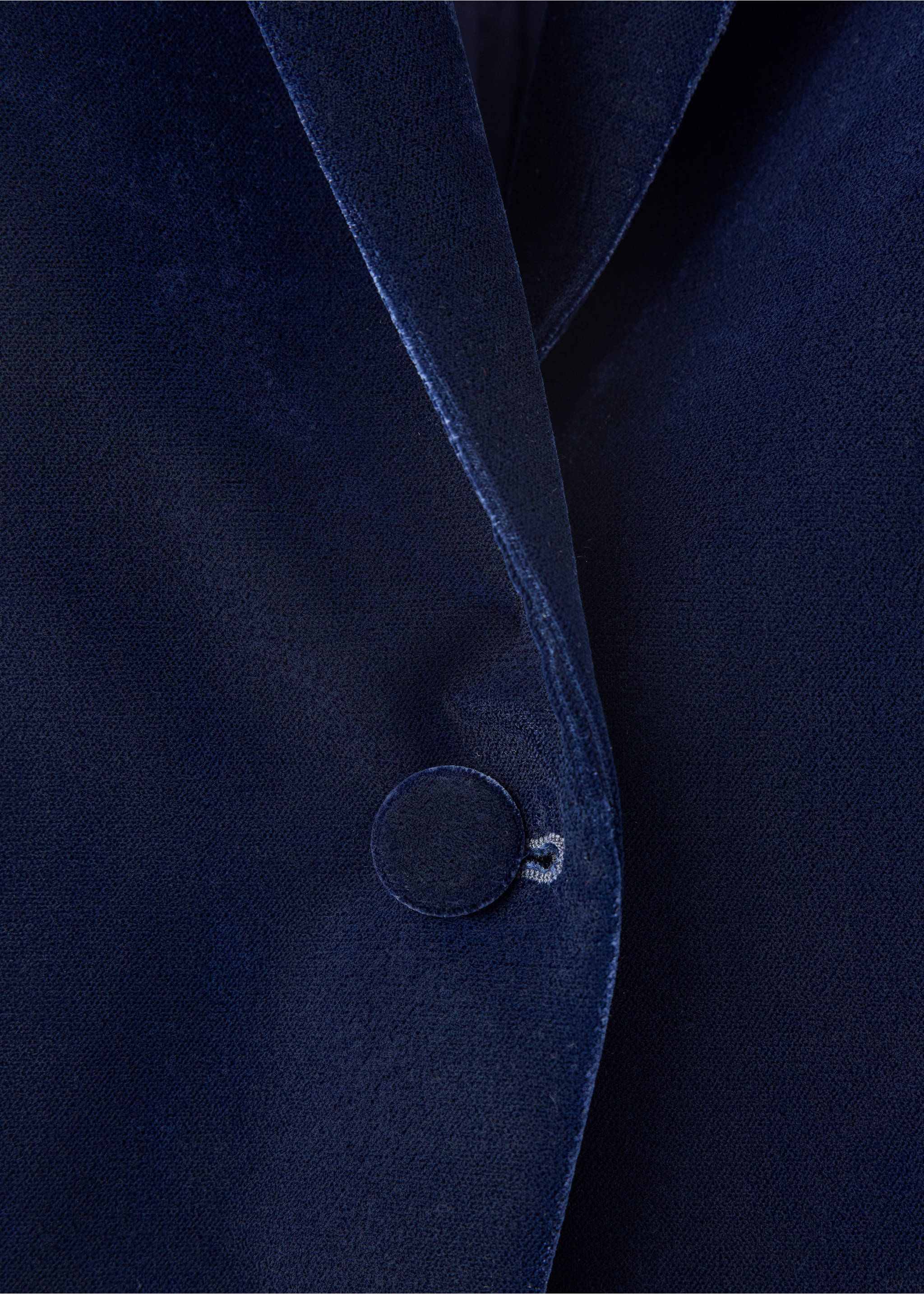 Close-up of a navy blue velvet blazer lapel and button detail., Navy. Ref: 37099114-00.