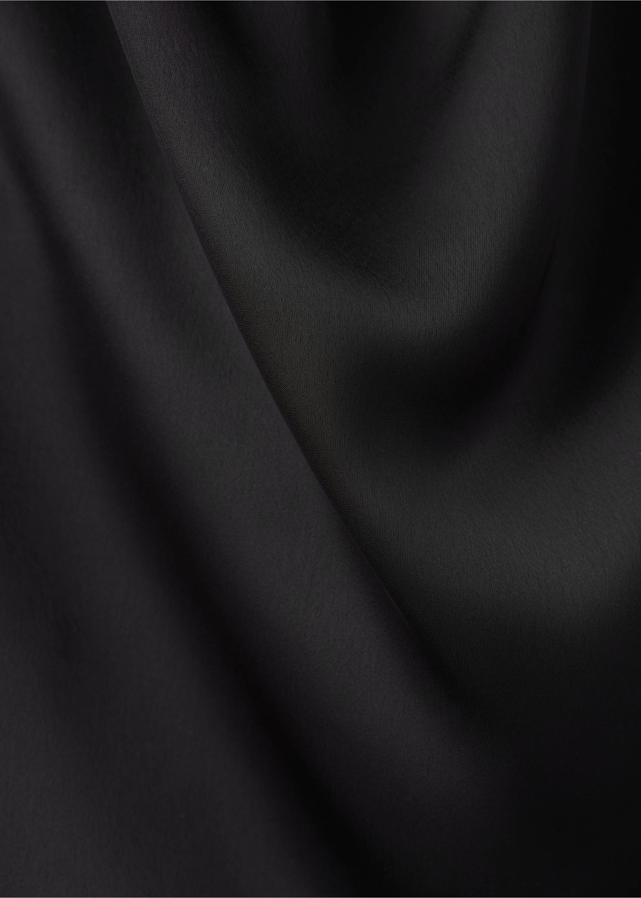 Close-up of smooth, fluid black fabric texture., Black. Ref: 37099116-00.