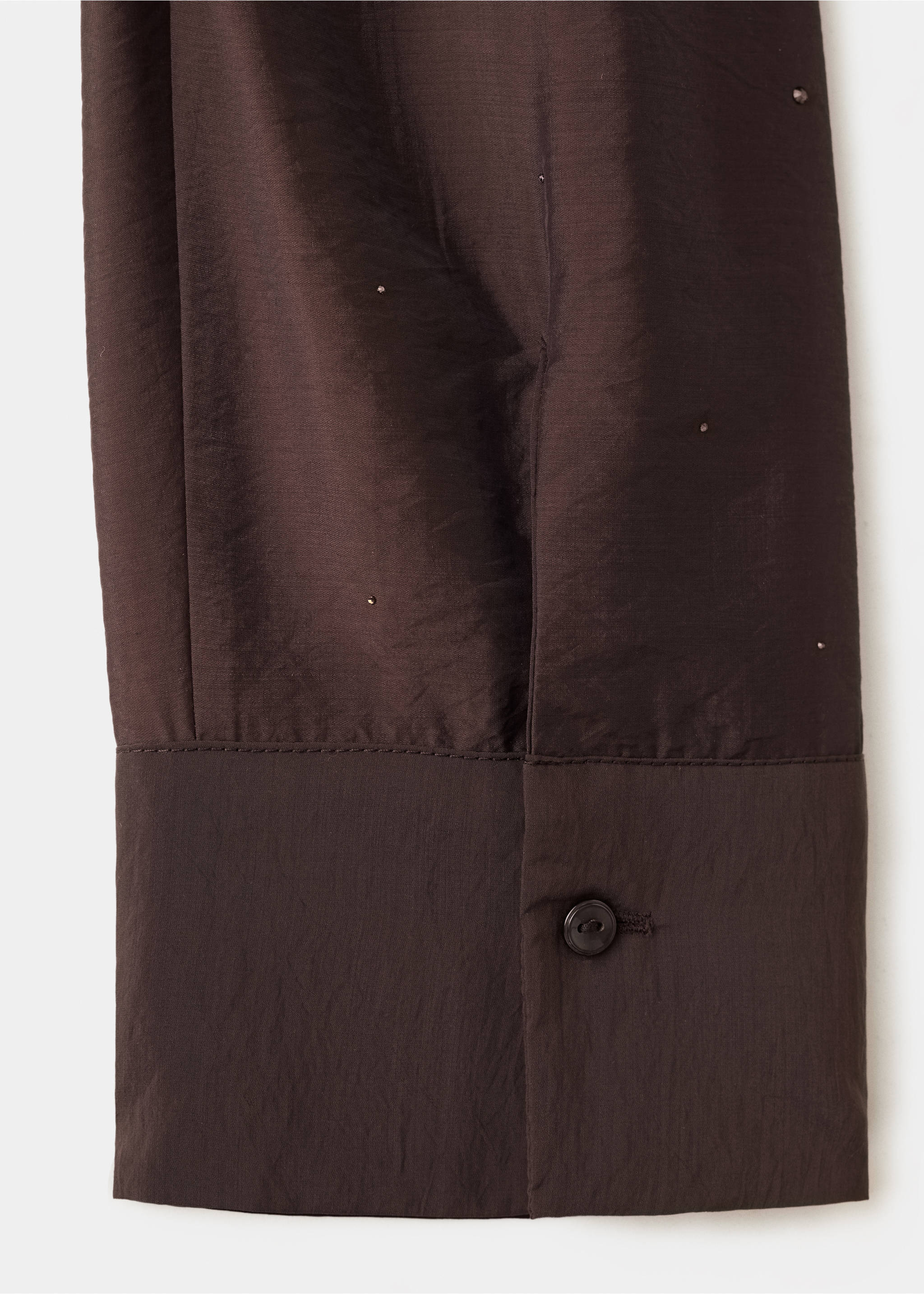 Close-up of brown shirt fabric with cuff detail and button., Brown. Ref: 37099118-00.