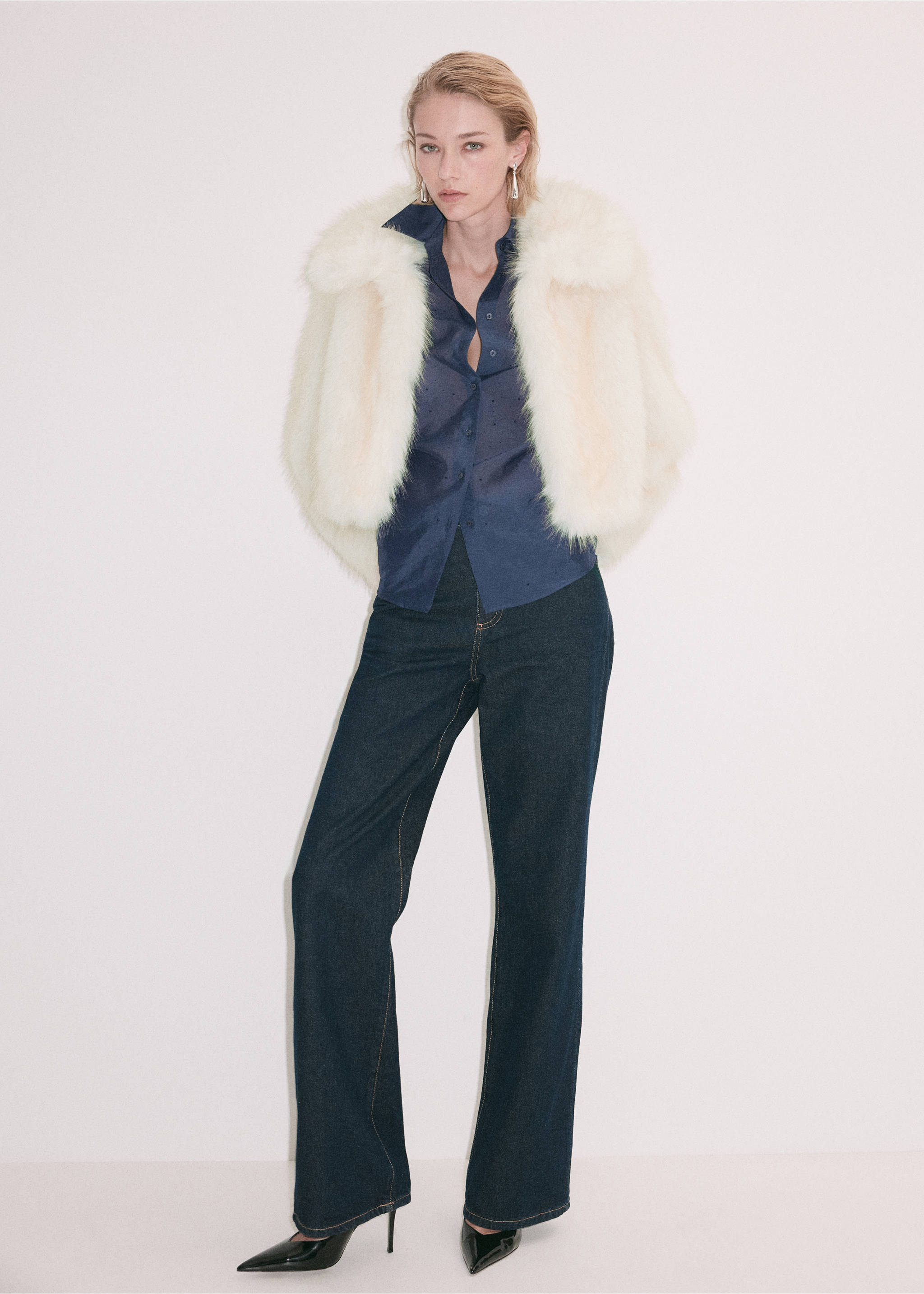 Dark navy blue button-up shirt with collar, worn with a white faux-fur jacket., Blue. Ref: 37099118-00.