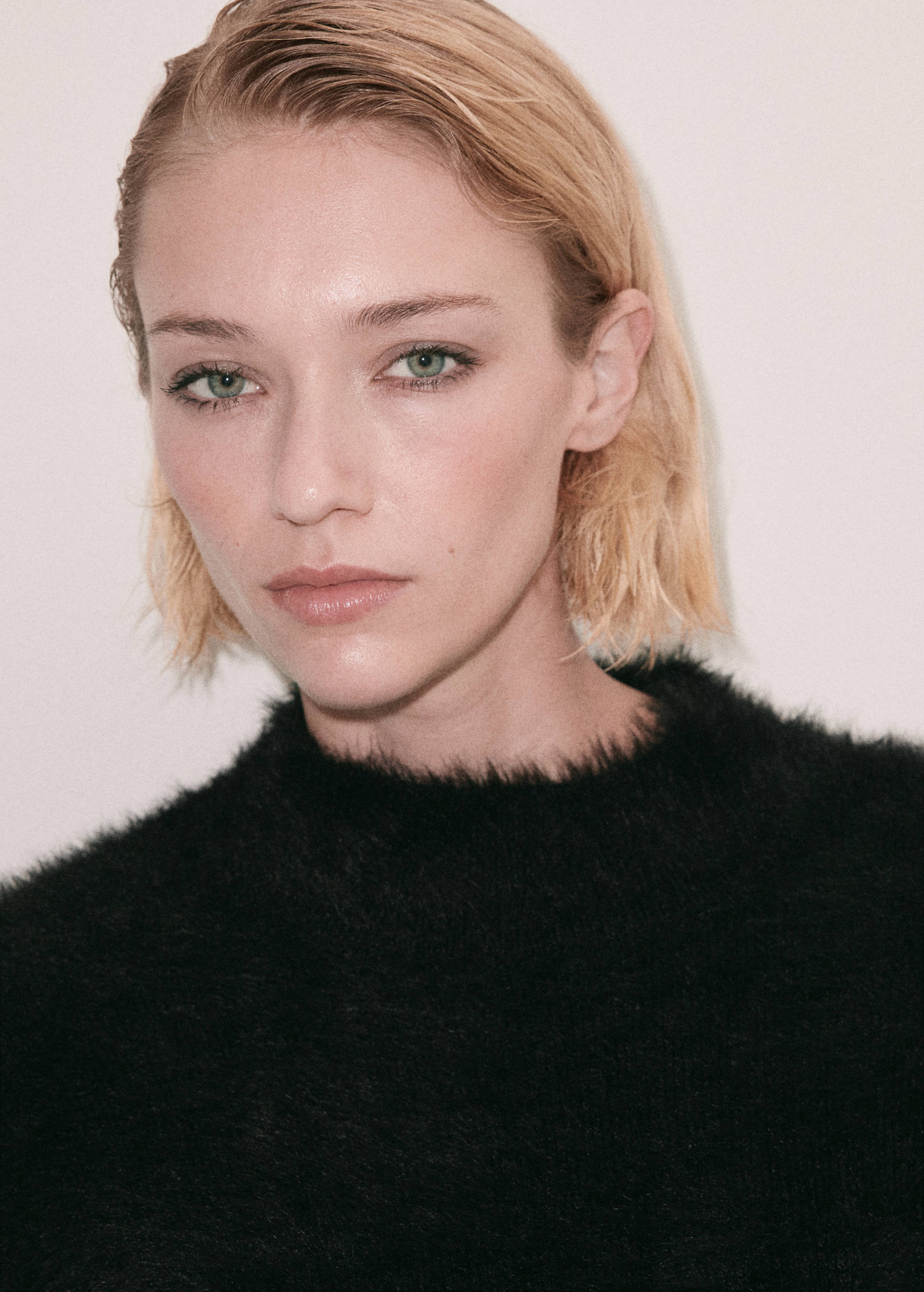 Black textured round-neck vest top, close-up.