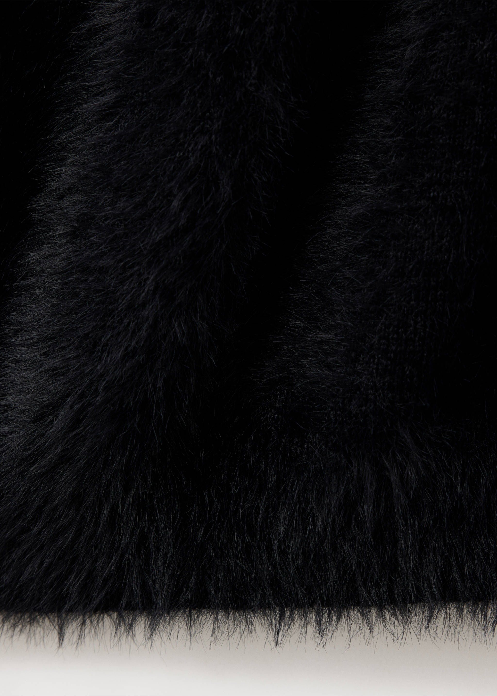 Close-up of black fuzzy textured waistcoat fabric., Black. Ref: 37099120-00.