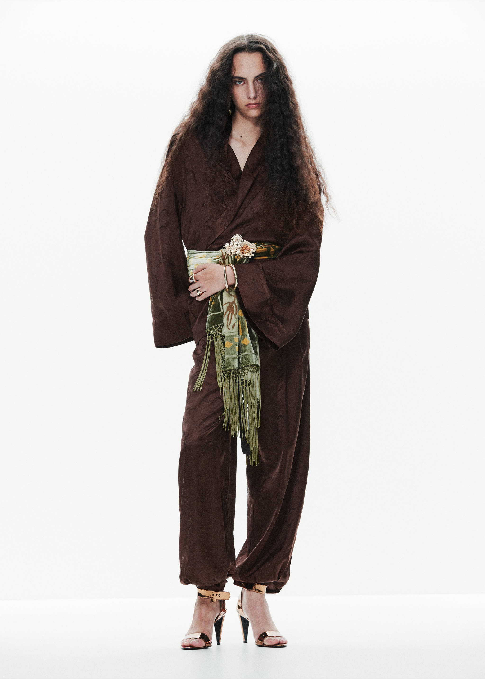 Dark brown patterned blazer with wide sleeves and matching trousers, worn with a fringed olive scarf., Brown. Ref: 37099128-00.