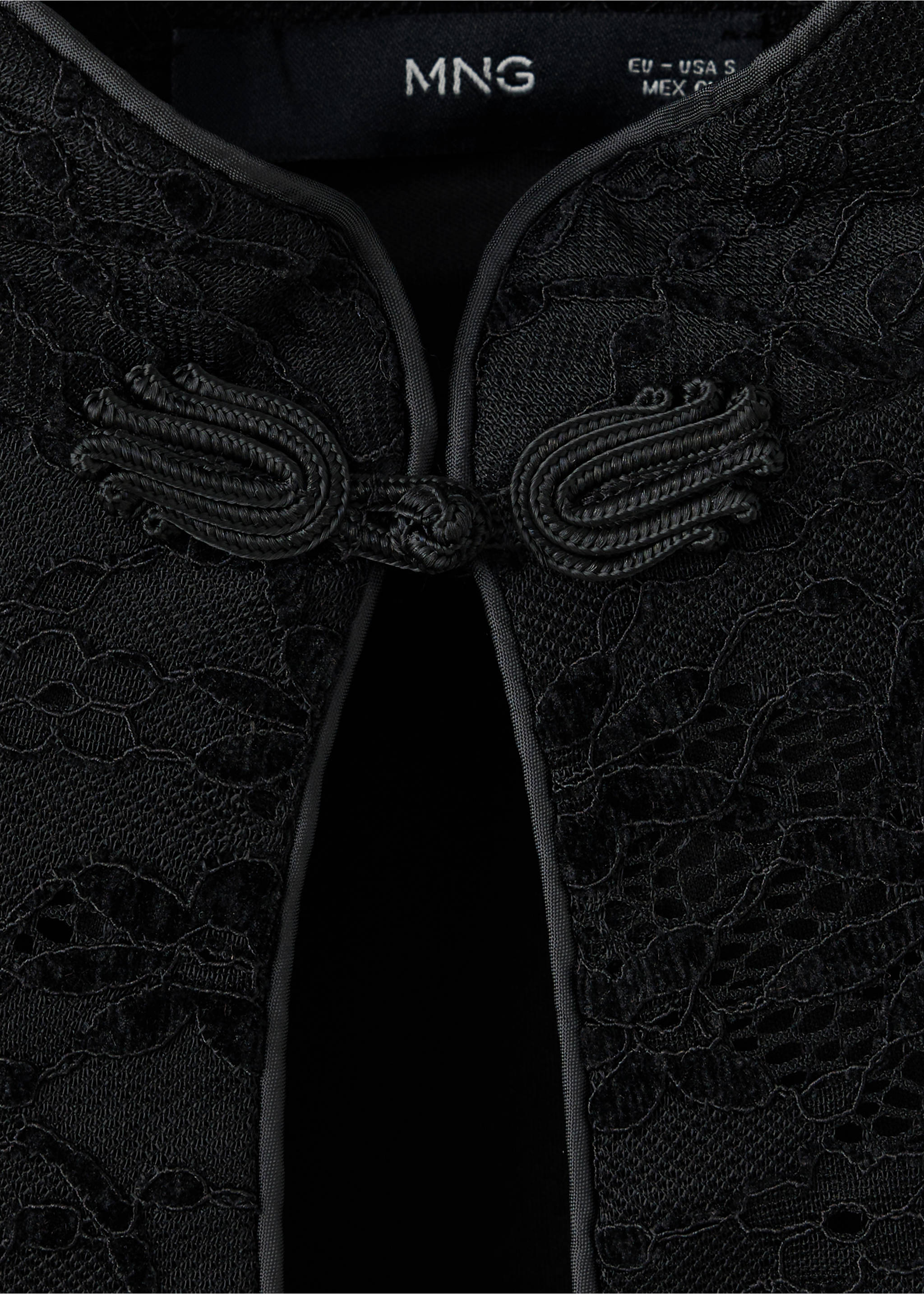 Close-up of a black lace dress with a Mandarin collar and frog closures., Black. Ref: 37099129-00.