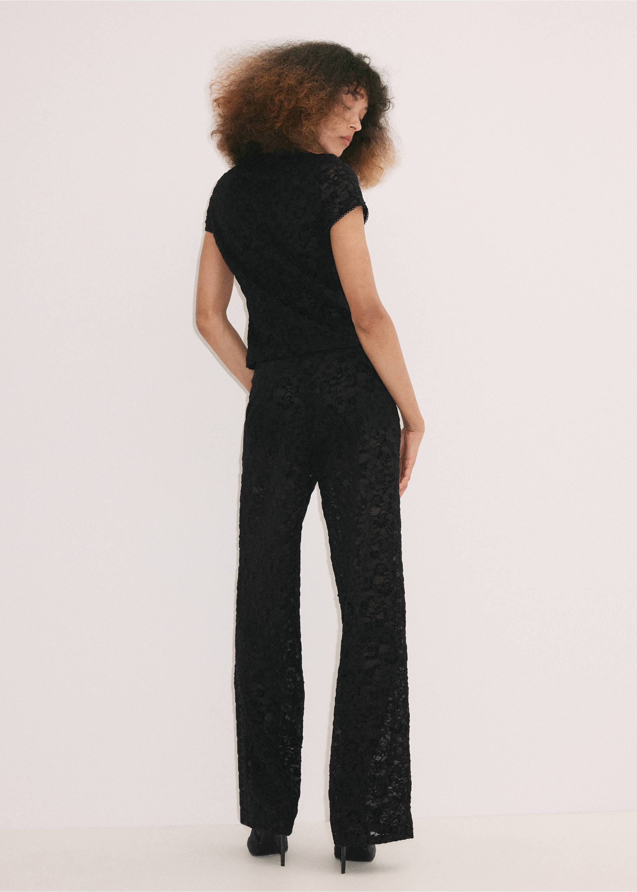 Black lace trousers shown from the back on a model., Black. Ref: 37099132-00.