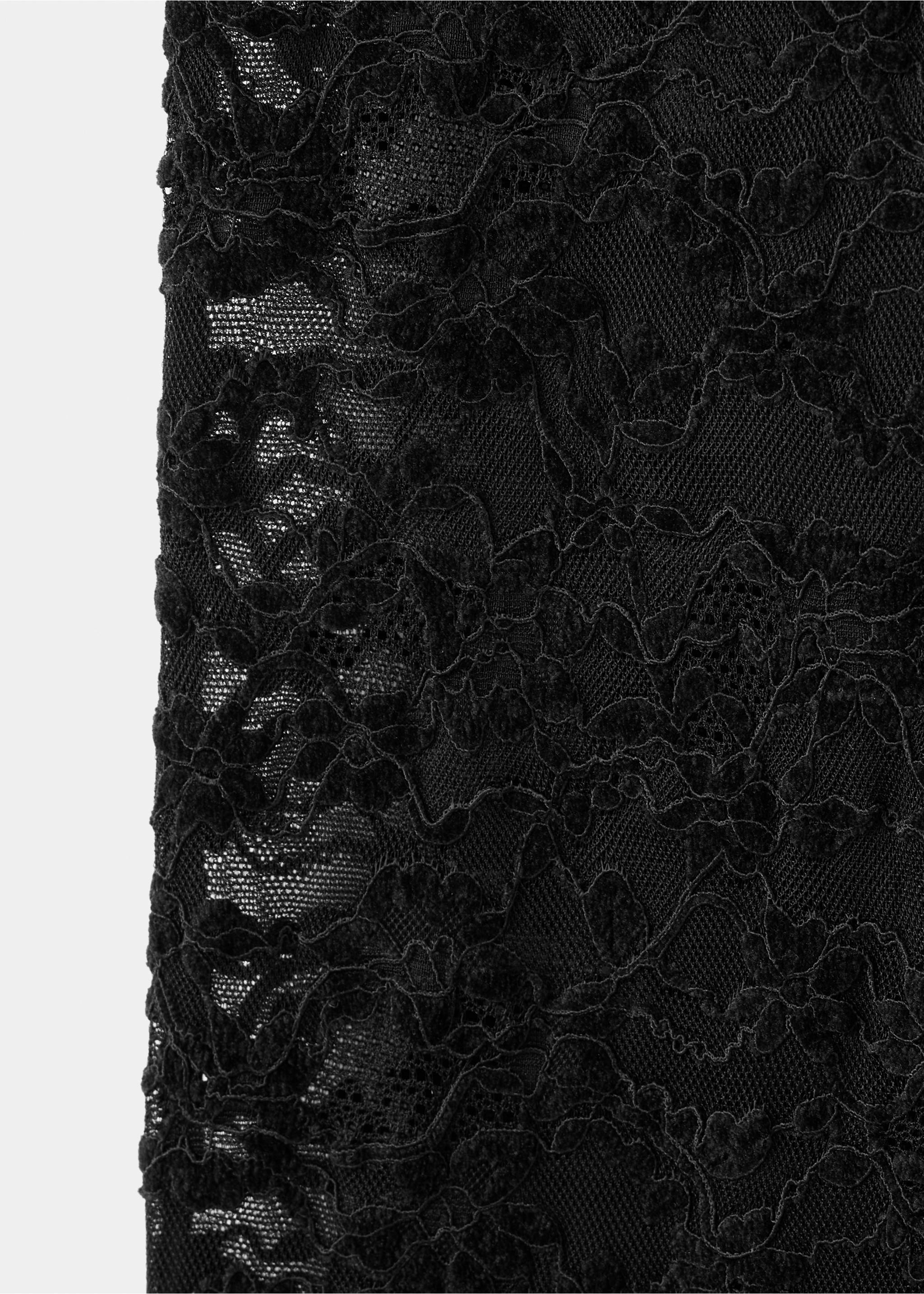 Black lace fabric detail of trousers showing a floral pattern and sheer mesh., Black. Ref: 37099132-00.