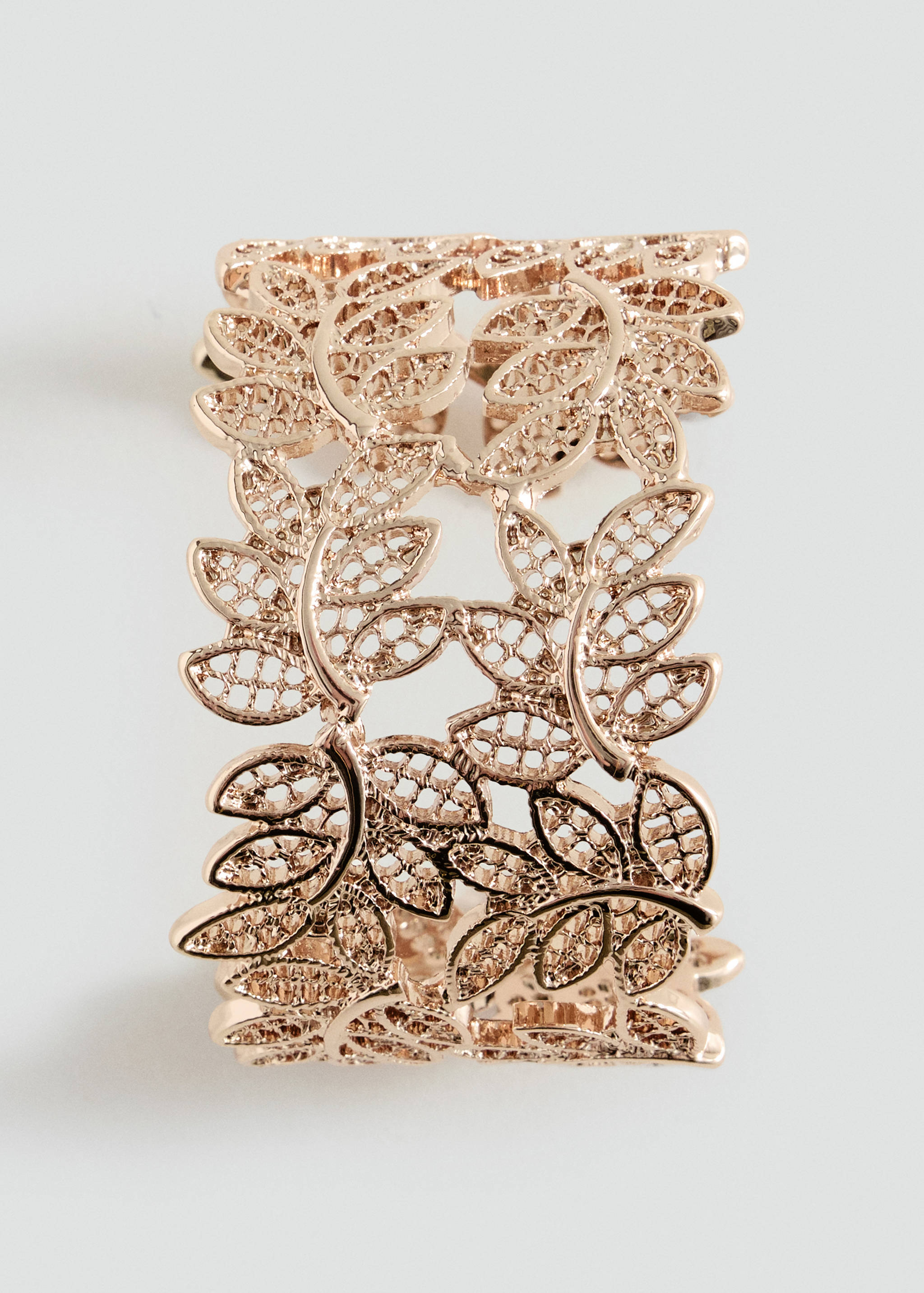Rose gold leaf-design cuff bracelet.