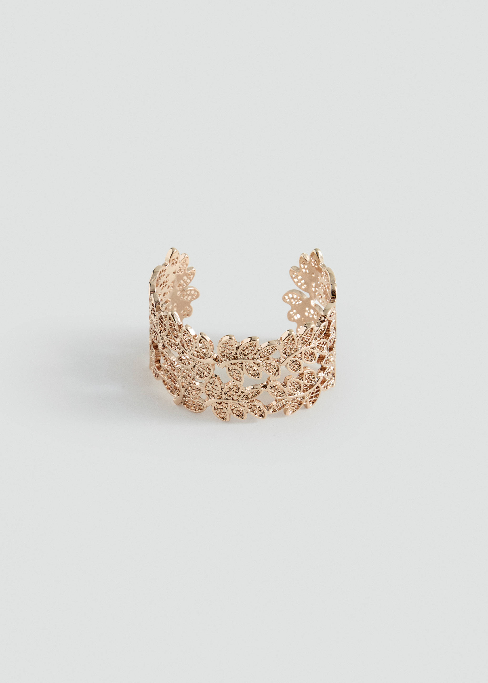 Rose gold cuff bracelet featuring an openwork leaf filigree design.