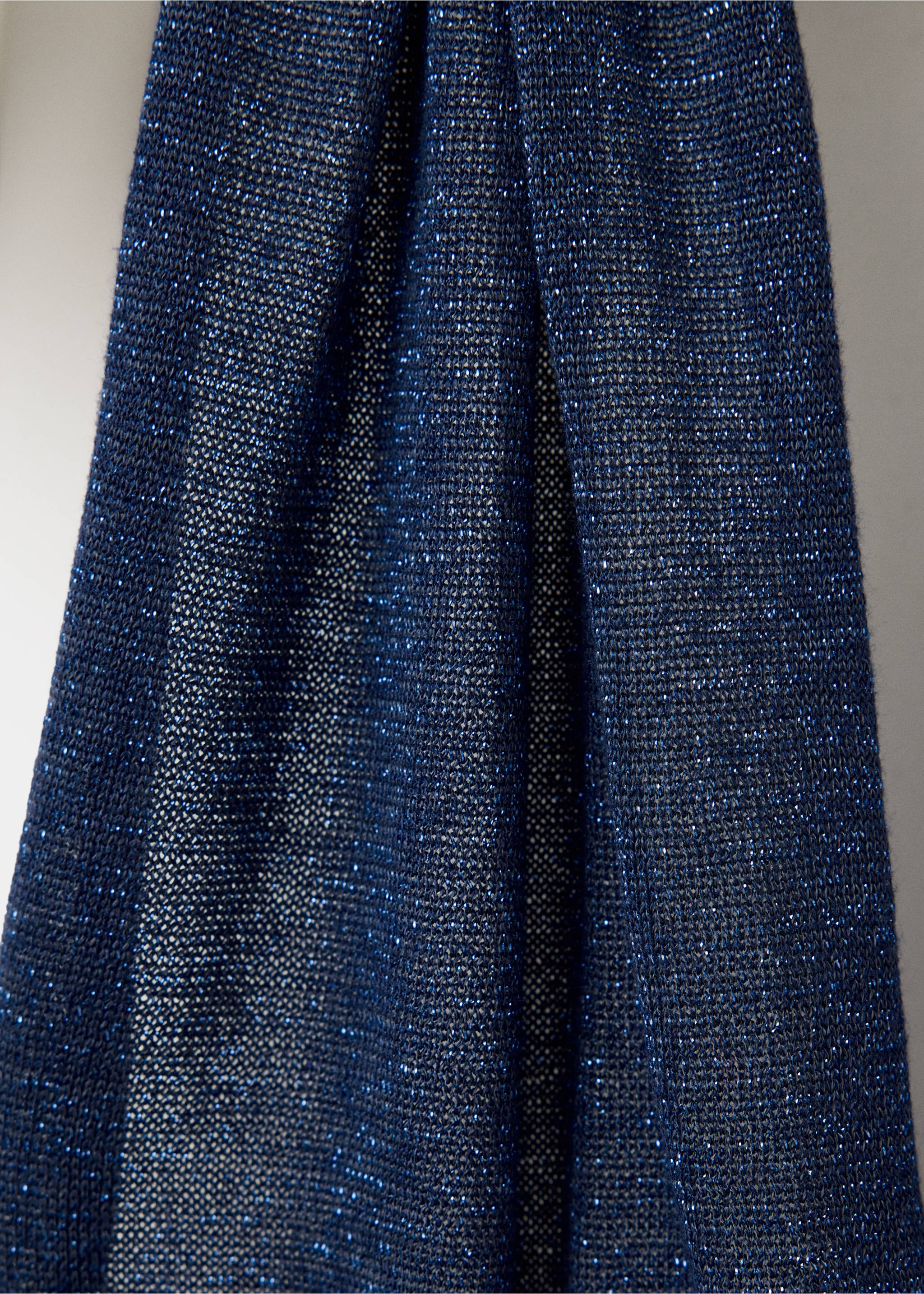 Close-up of a navy blue metallic knit top with a sparkle finish., Navy. Ref: 37099134-00.