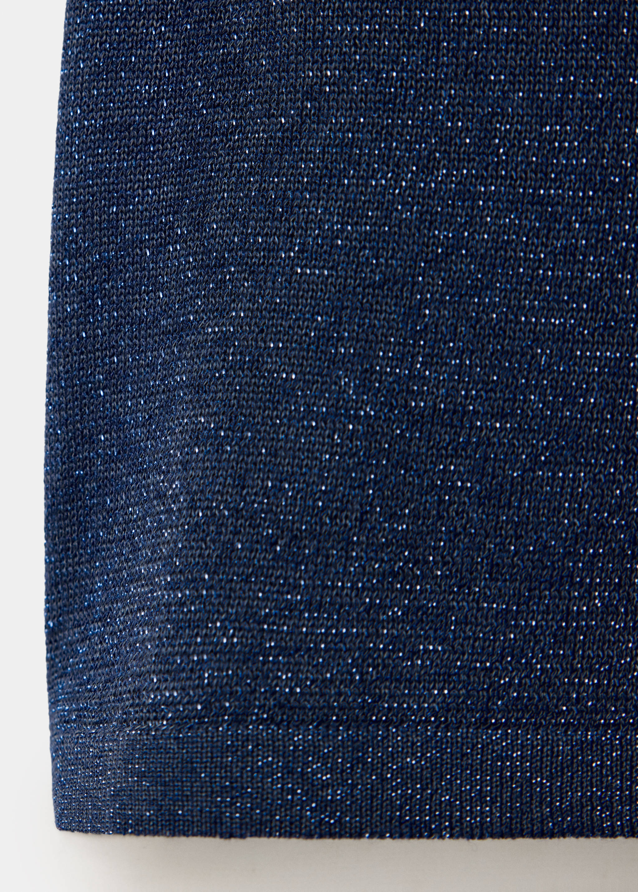 Close-up of a blue metallic knit top fabric.