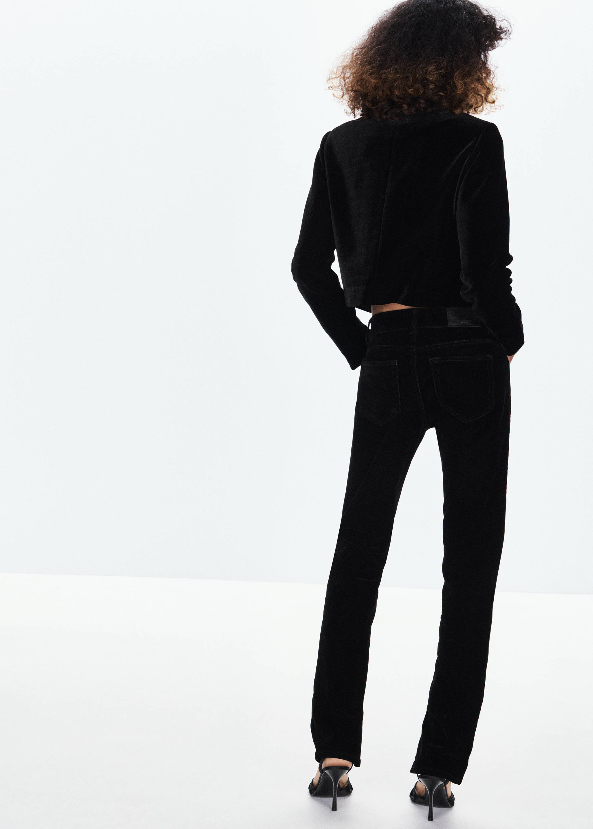 Black cropped velvet jacket, back view
