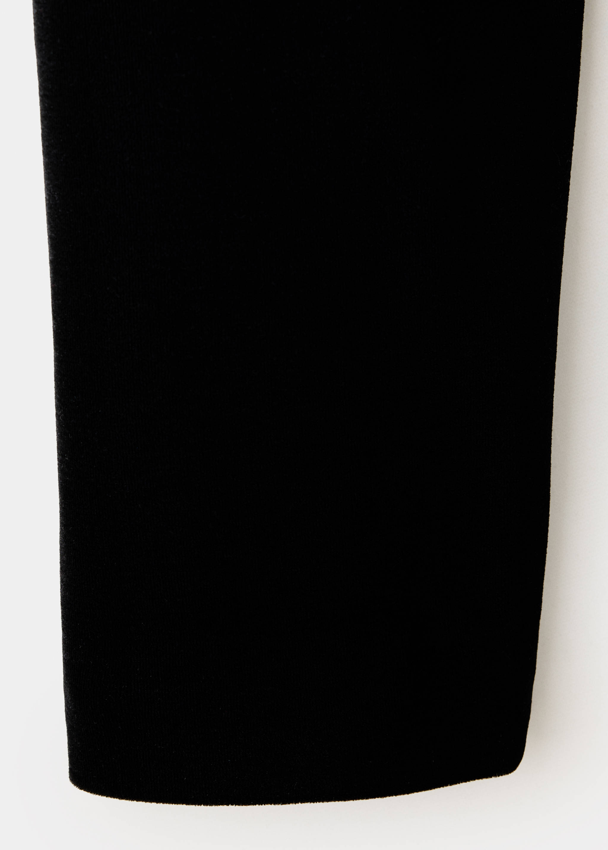 Close-up of the smooth black fabric texture of a jacket.