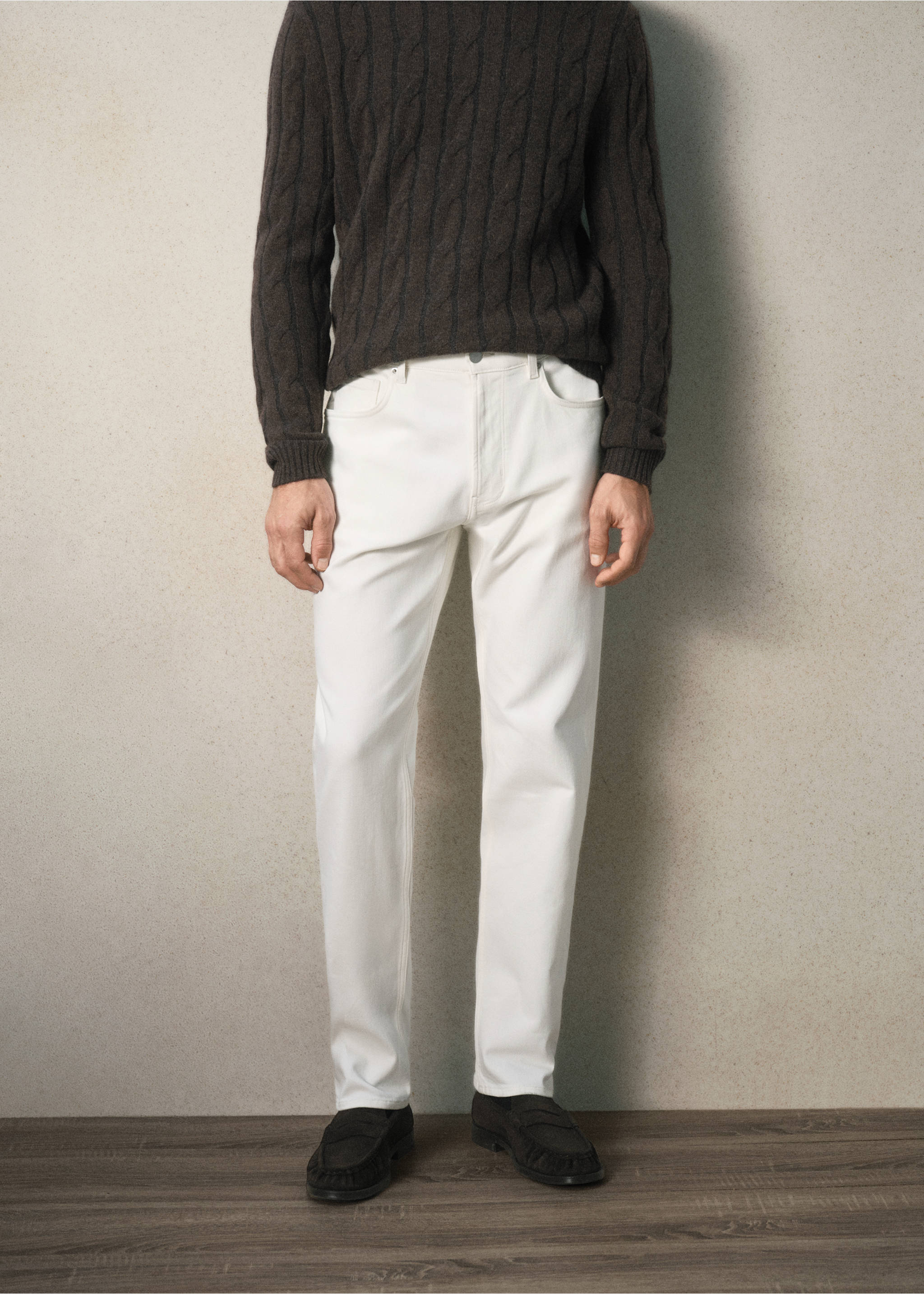 White denim trousers styled with a dark brown cable-knit jumper., Off White. Ref: 37099207-00.