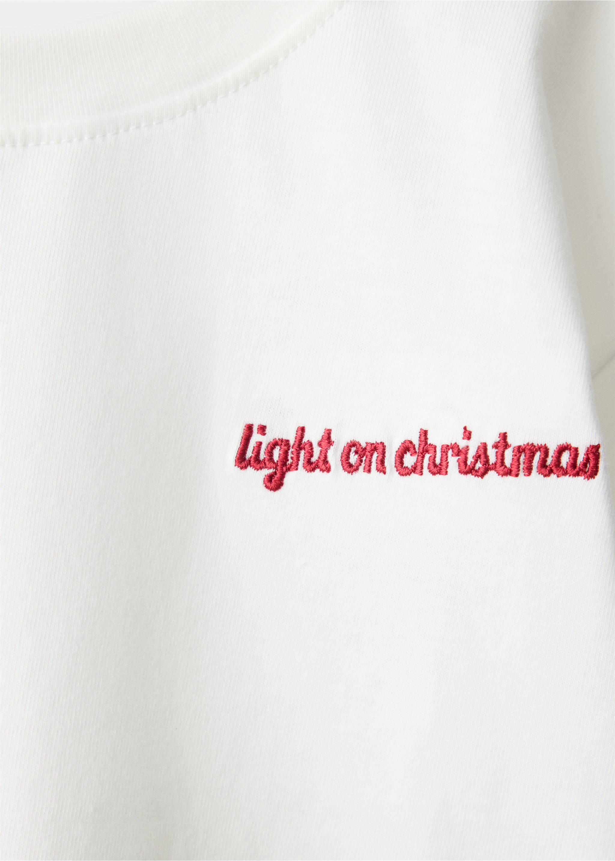 White t-shirt fabric detail with red embroidered text., Off White. Ref: 37099208-00.