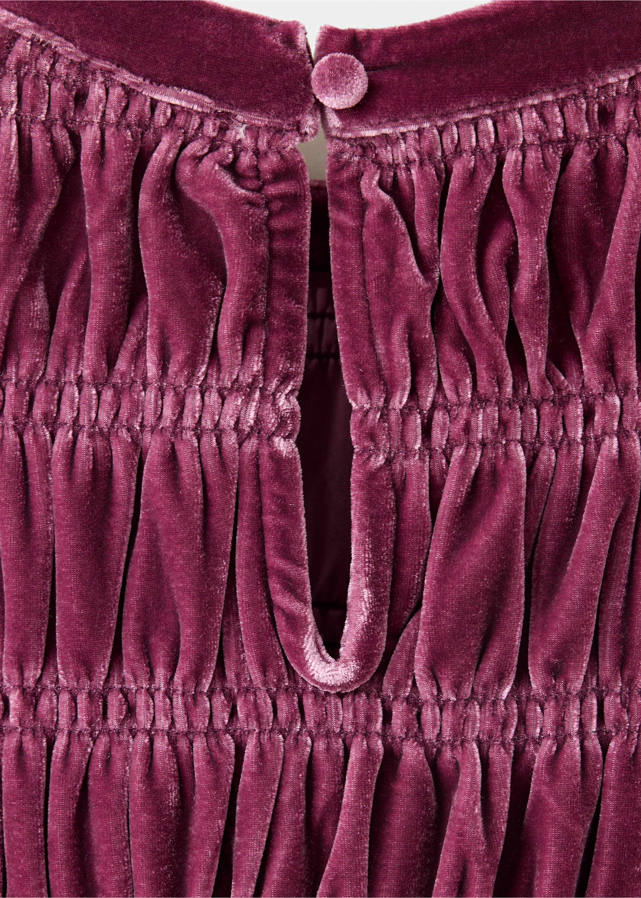 Close-up of plum velvet dress fabric showing gathered bodice and back button., Cherry. Ref: 37099210-00.