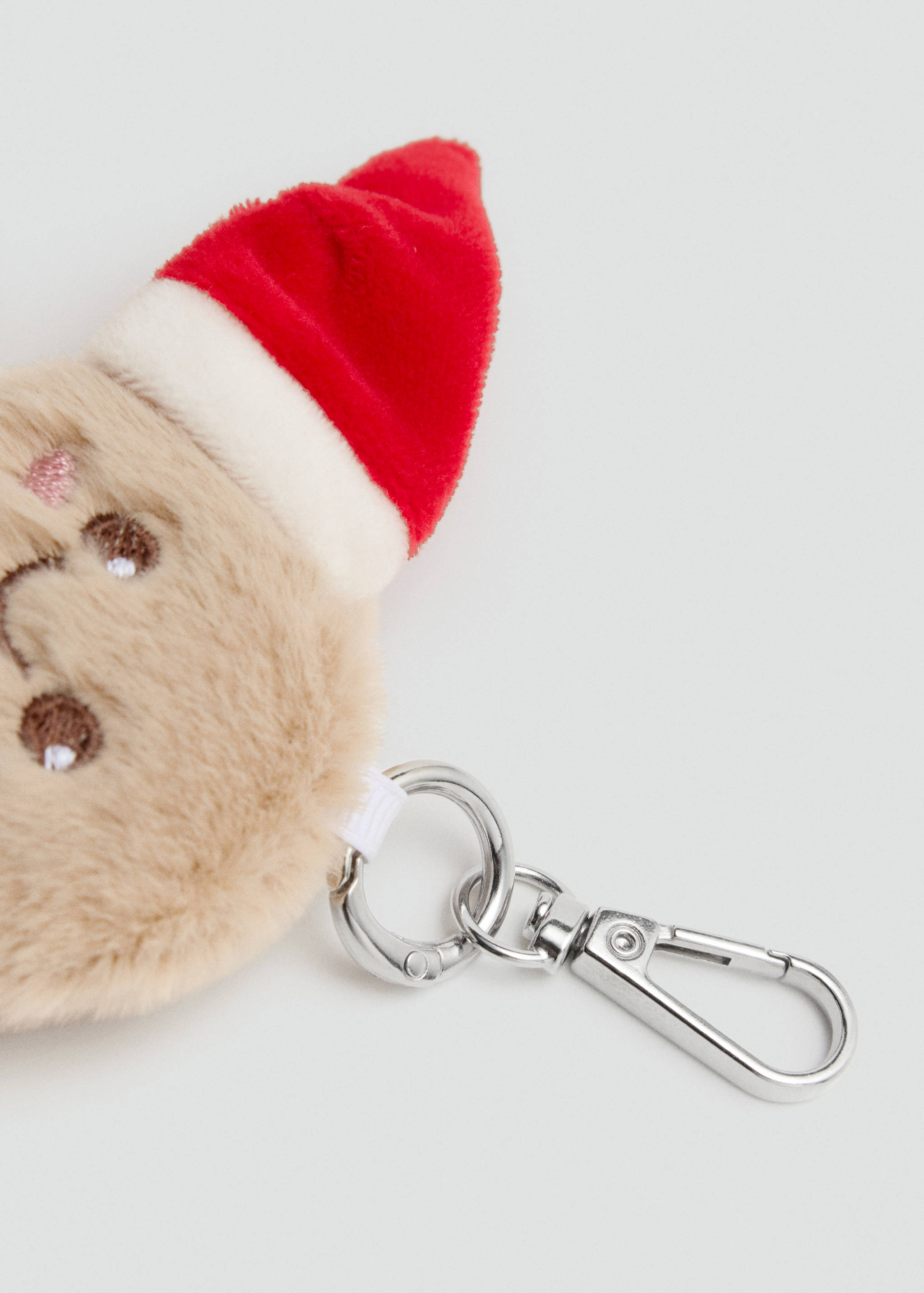 Beige faux-fur gingerbread keychain with a red Santa hat and silver metal clasp.