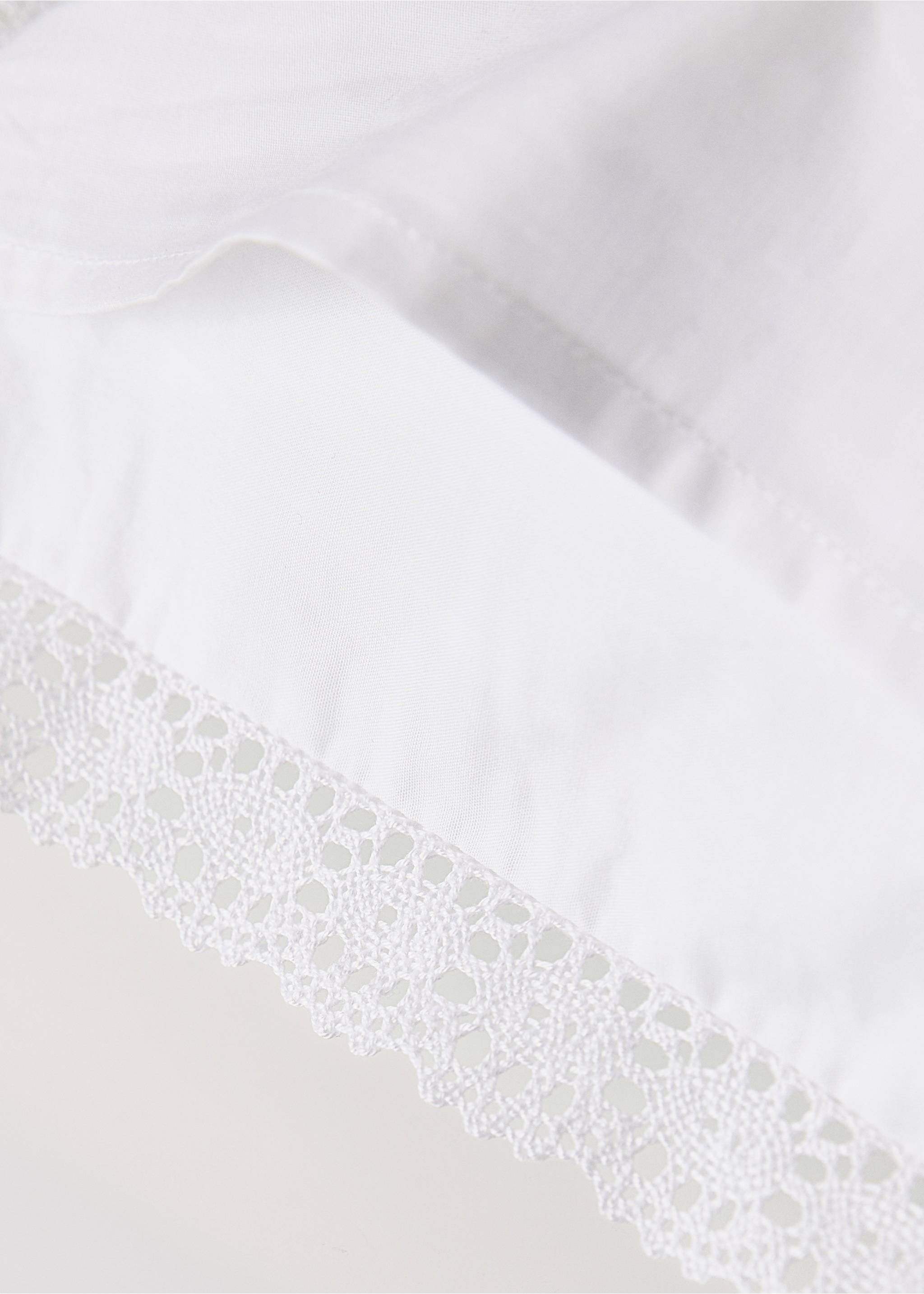 White cushion cover with lace trim, close-up., White. Ref: 37141588-00.