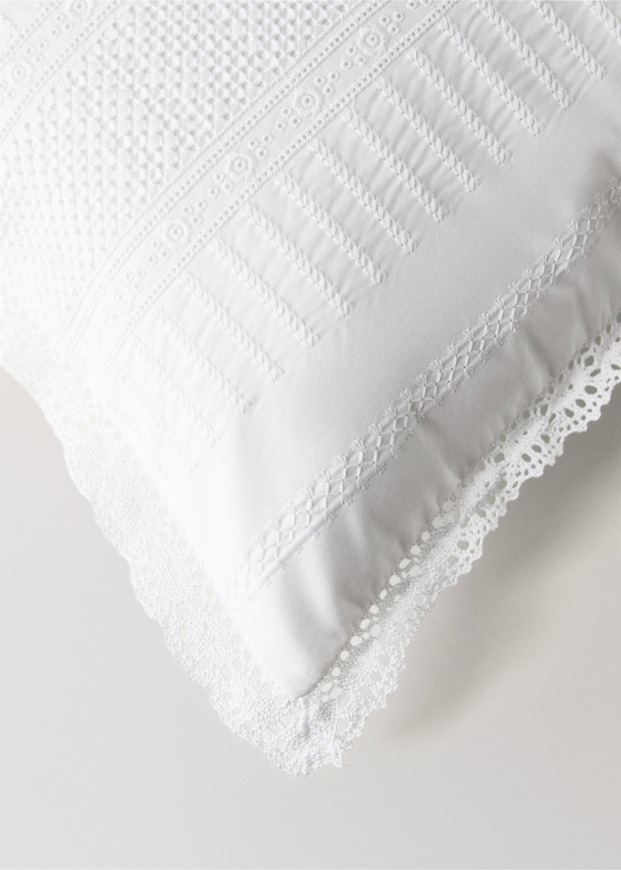 White cushion cover with intricate embroidery, pintucks, and lace trim., White. Ref: 37141588-00.
