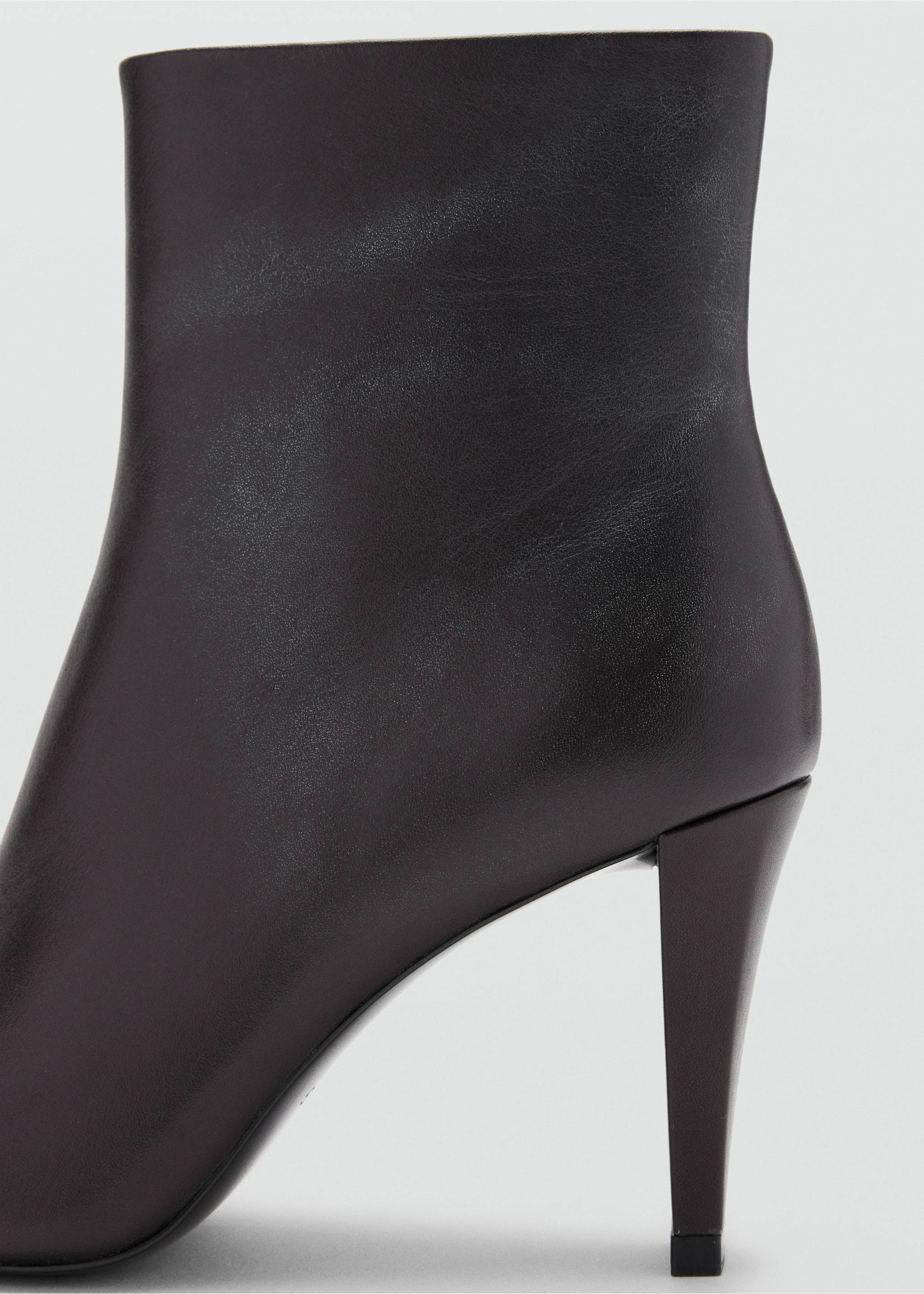 Close-up of a black stiletto ankle boot with a smooth finish., Chocolate. Ref: 47001341-00.