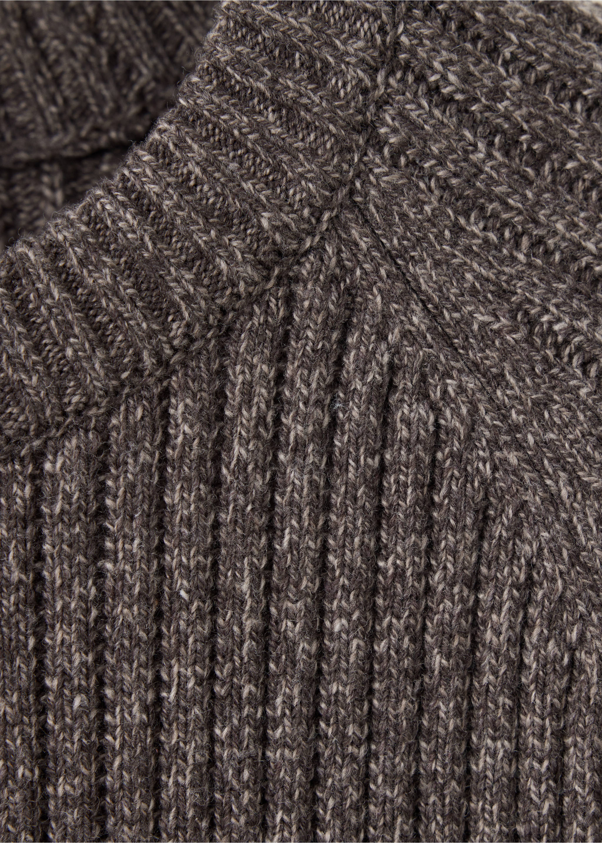 Close-up of a dark brown melange knitted jumper showing the ribbed texture and collar., Brown. Ref: 47001393-00.