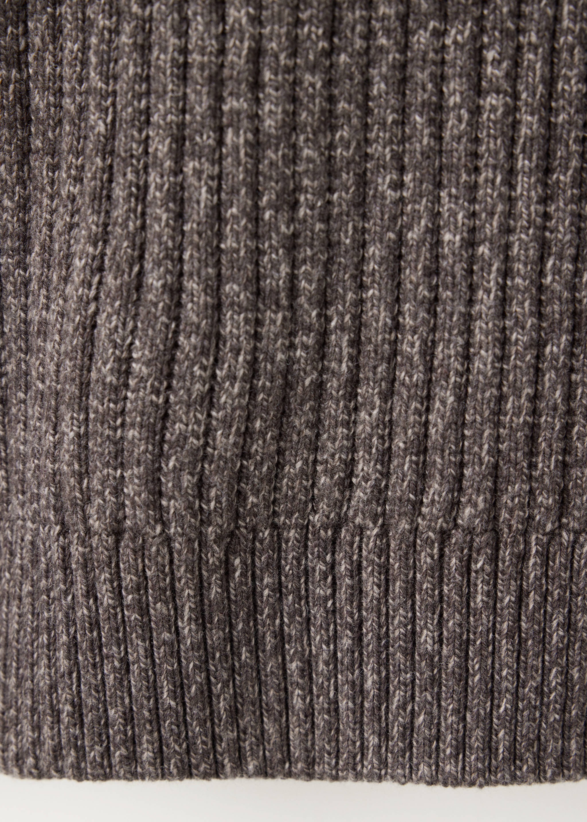 Close-up of a grey ribbed knit jumper texture.