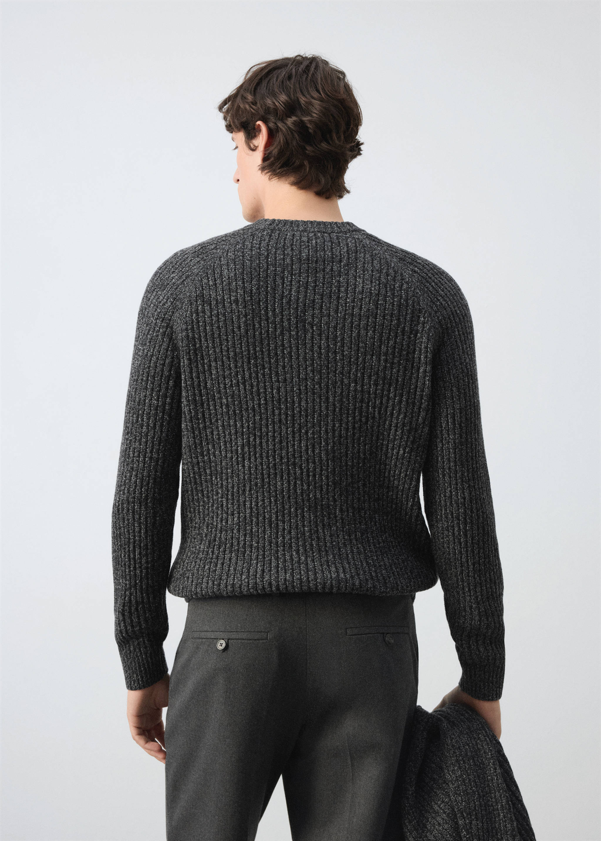 Dark grey ribbed knit jersey seen from the back, with a round neckline.