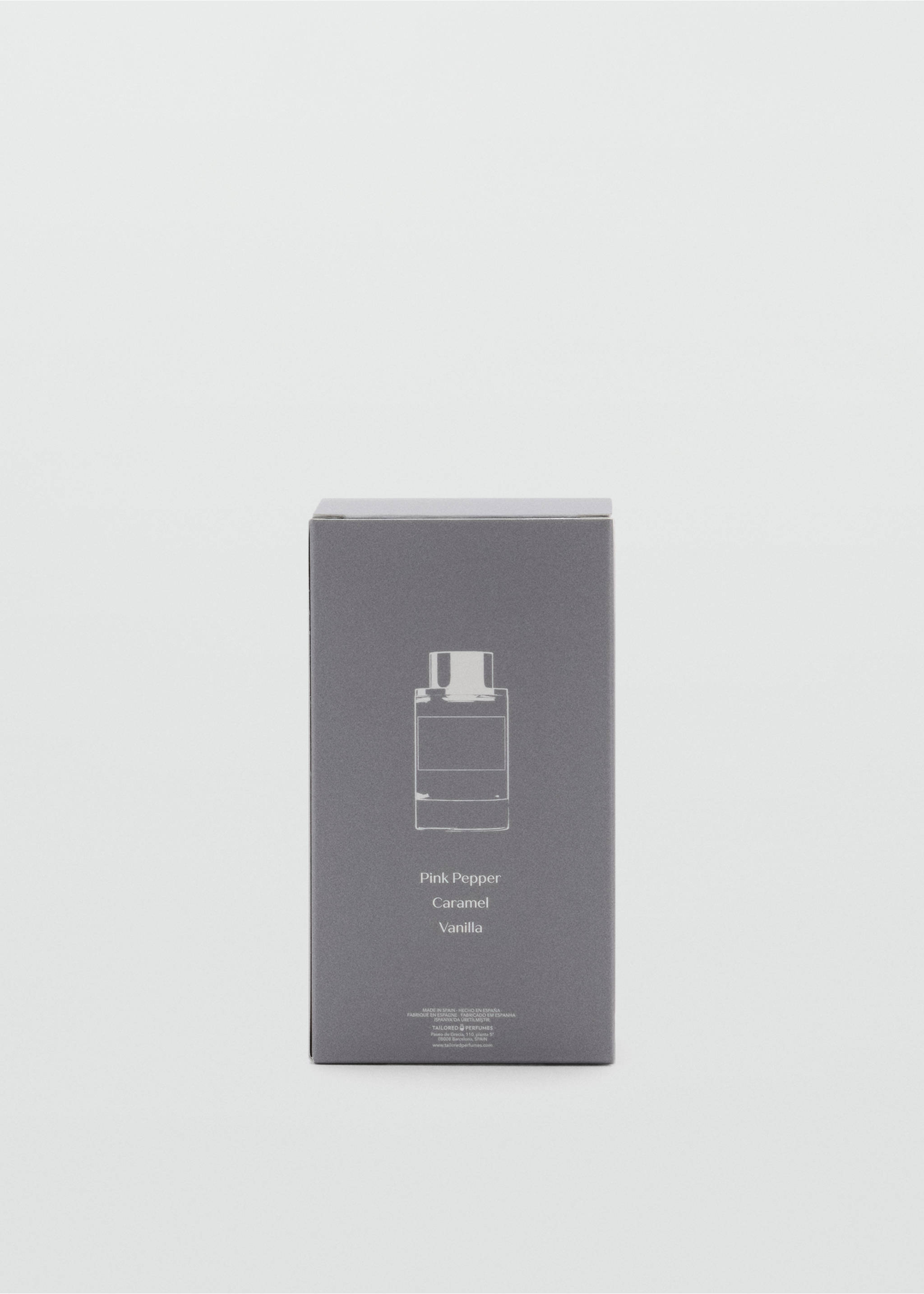 Close-up of a grey perfume box detailing pink pepper, caramel, and vanilla notes., Mink Grey. Ref: 47001439-00.