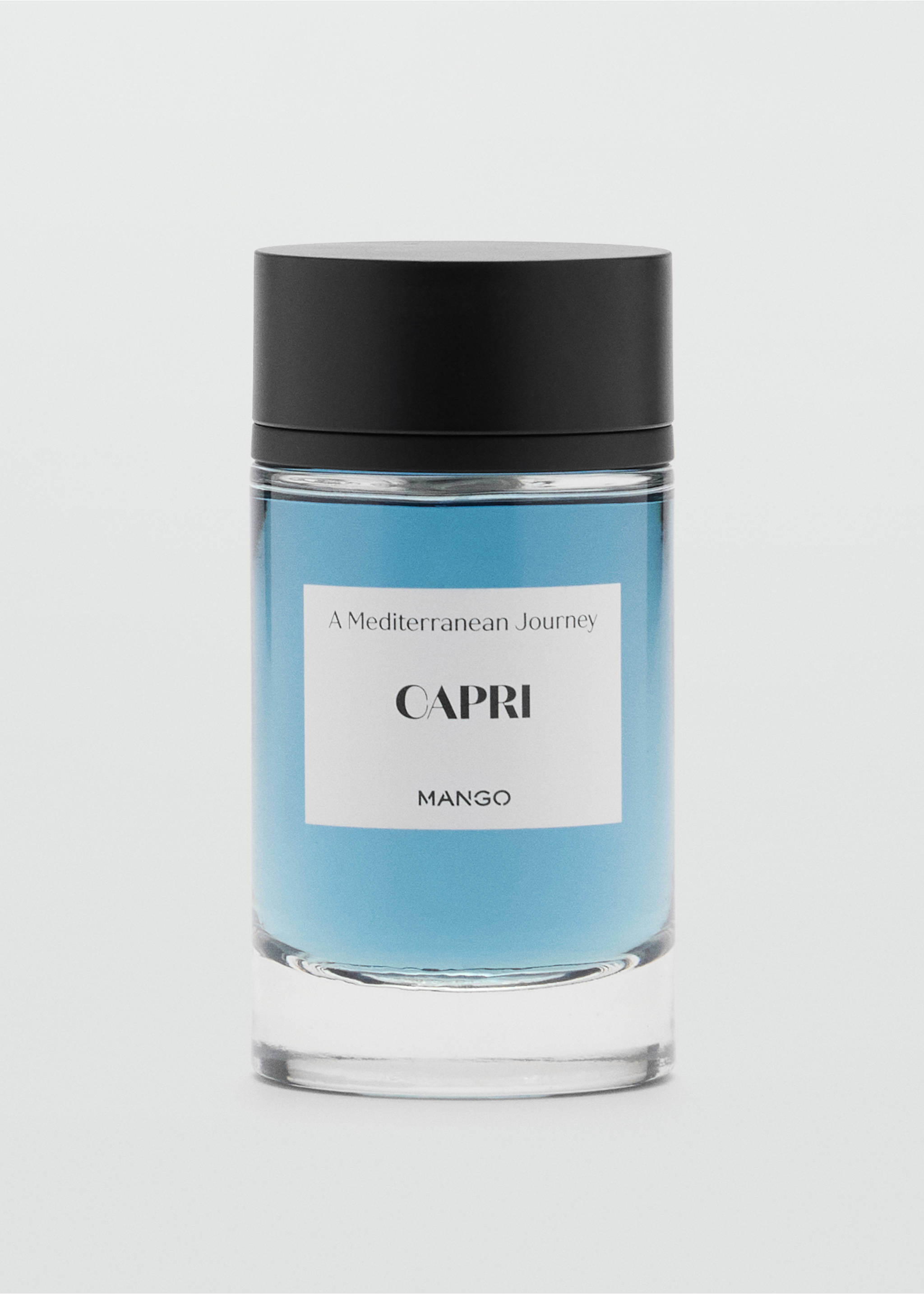 Perfume bottle in blue with a black cap and a label reading Capri., Mink Grey. Ref: 47001440-00.
