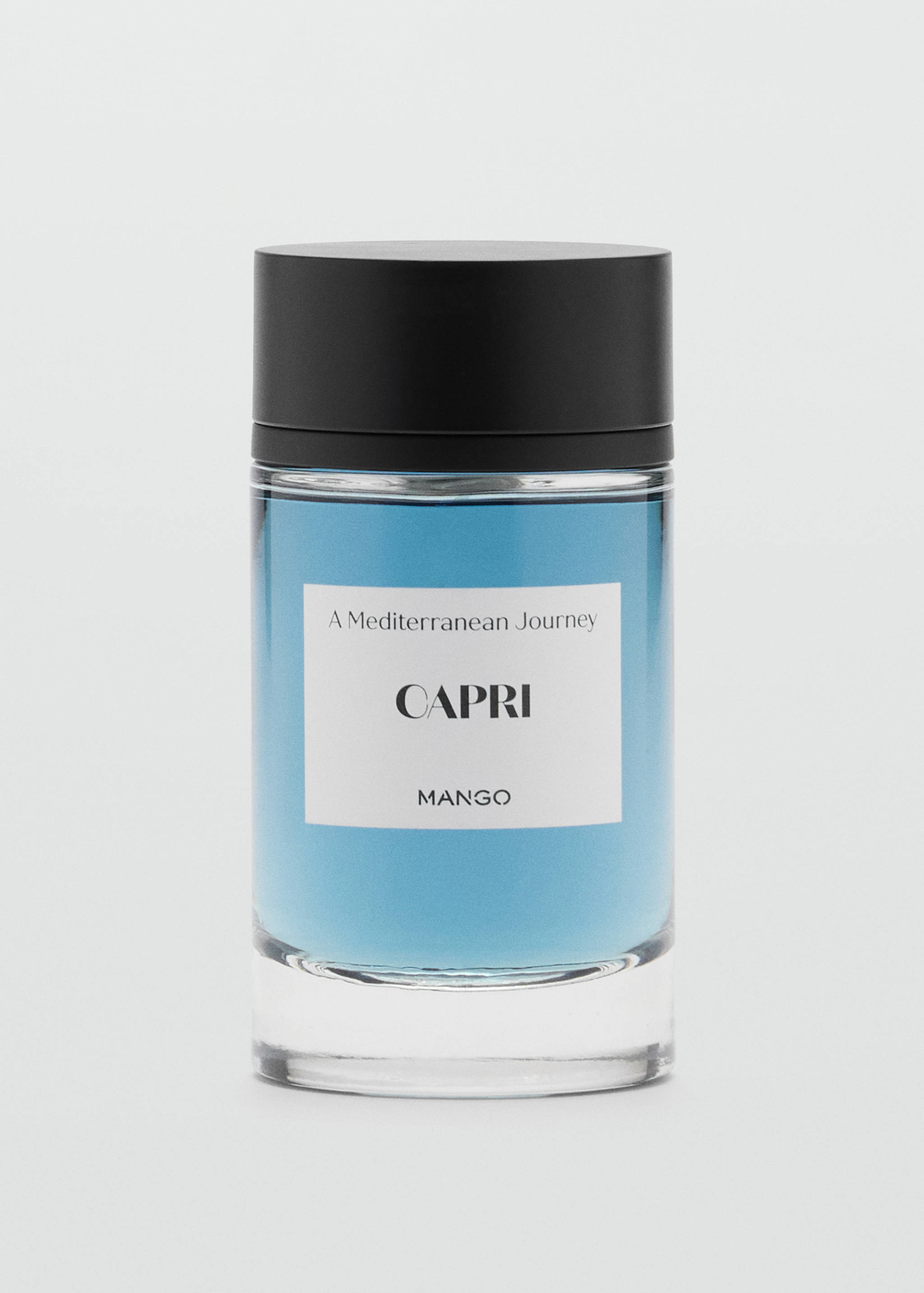 Perfume bottle in blue with a black cap and a label reading Capri.