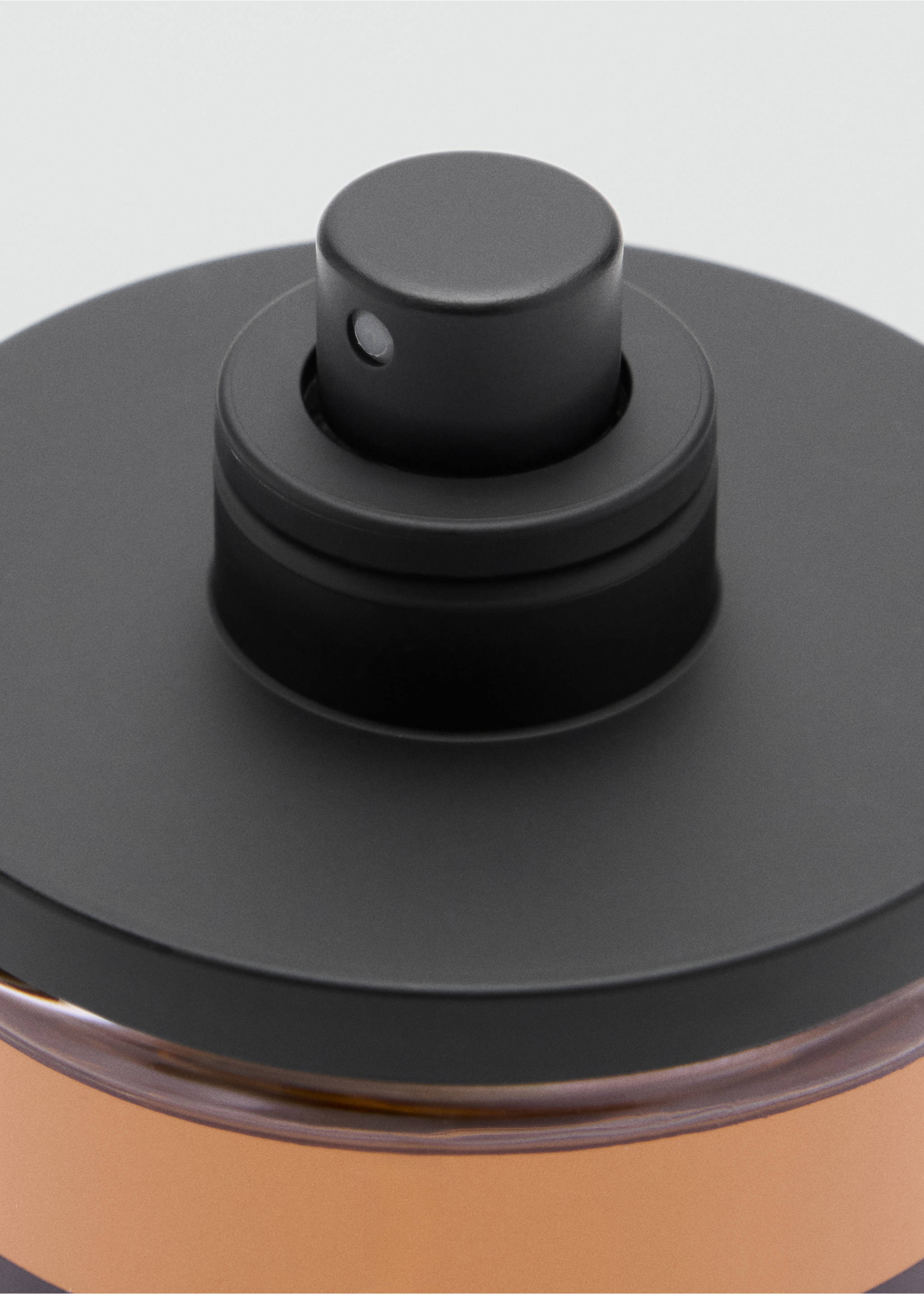 Close-up of the black spray nozzle on a perfume bottle., Mink Grey. Ref: 47001442-00.