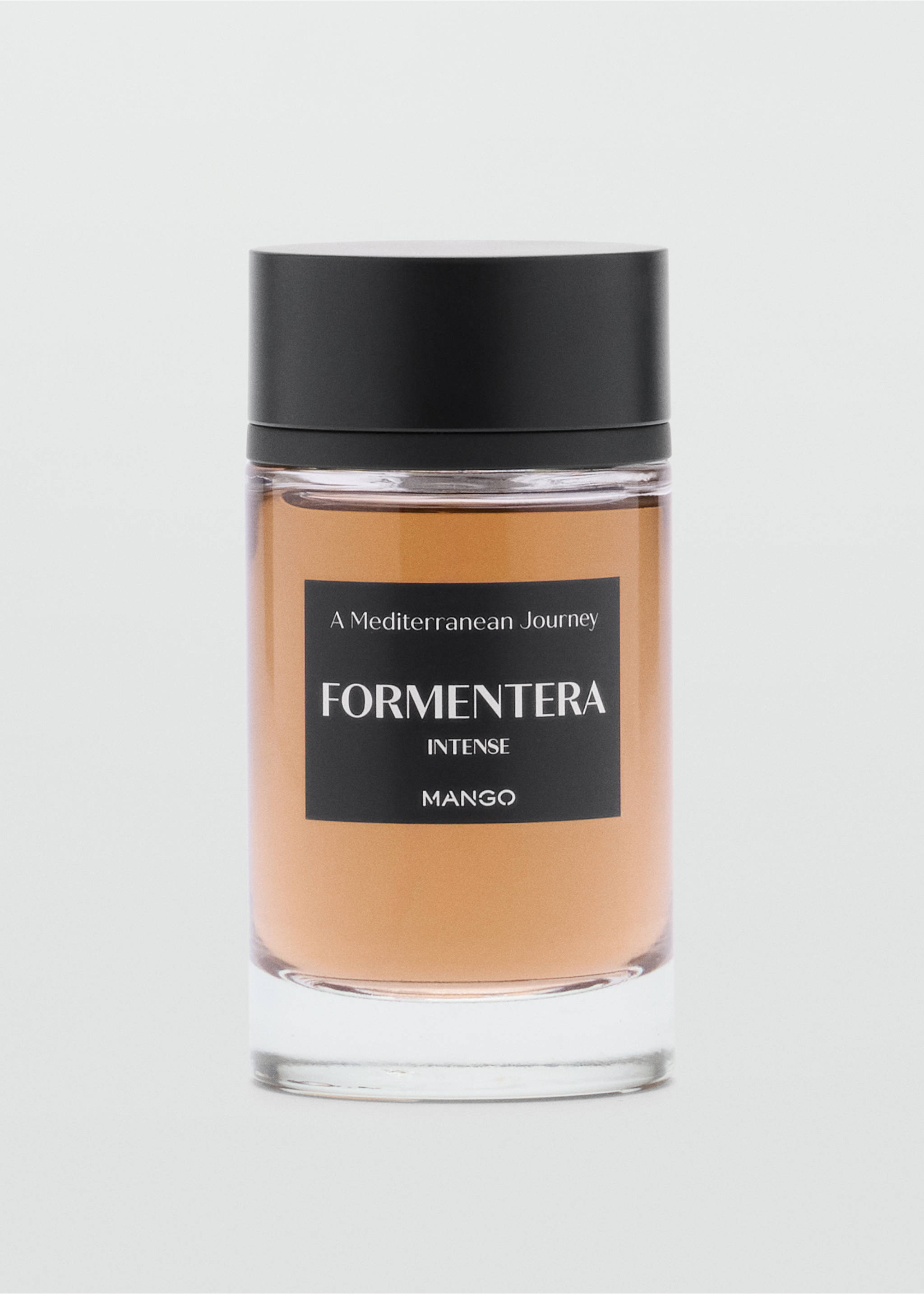 Cylindrical glass perfume bottle with an amber liquid and black cap., Mink Grey. Ref: 47001442-00.