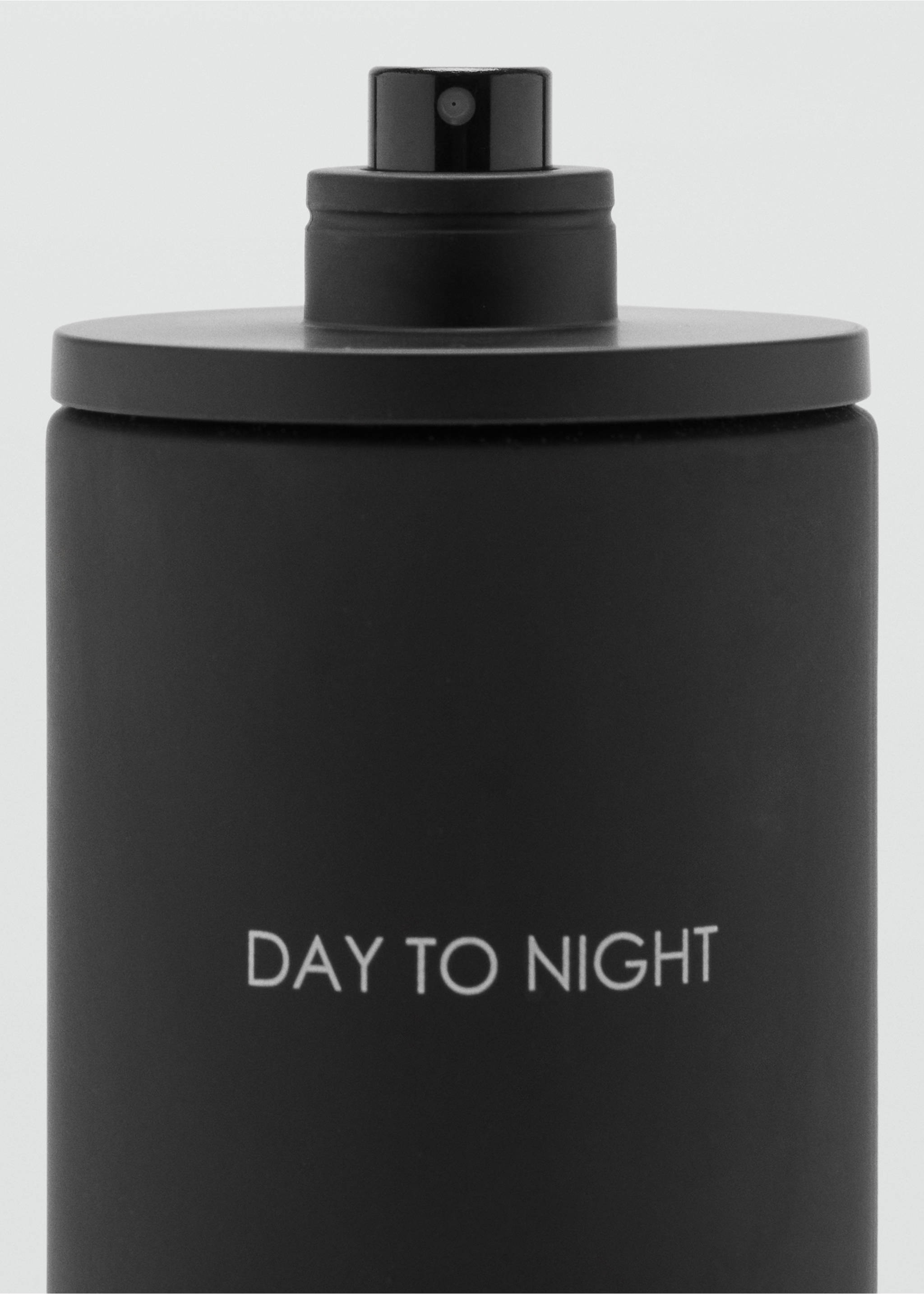 Close-up of a matte black perfume bottle with white text., Mink Grey. Ref: 47001444-00.