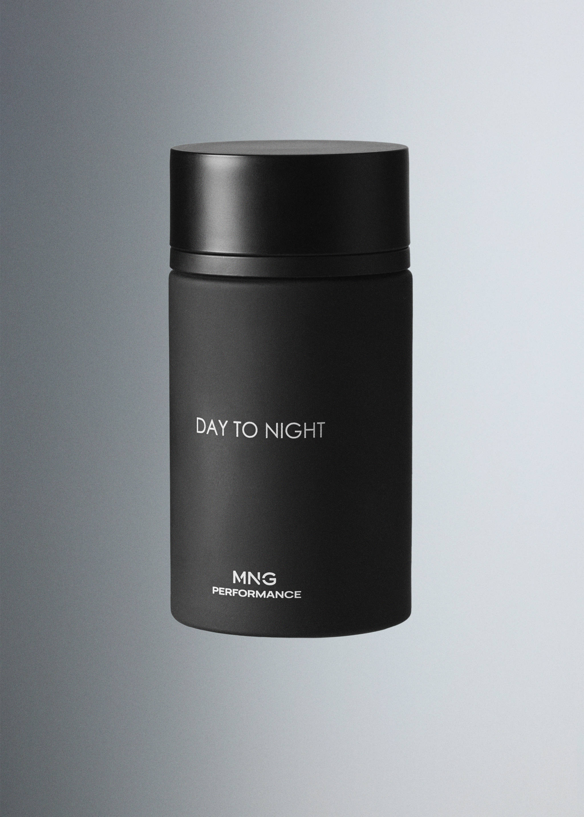 Black cylindrical perfume bottle with white text and a matching cap.