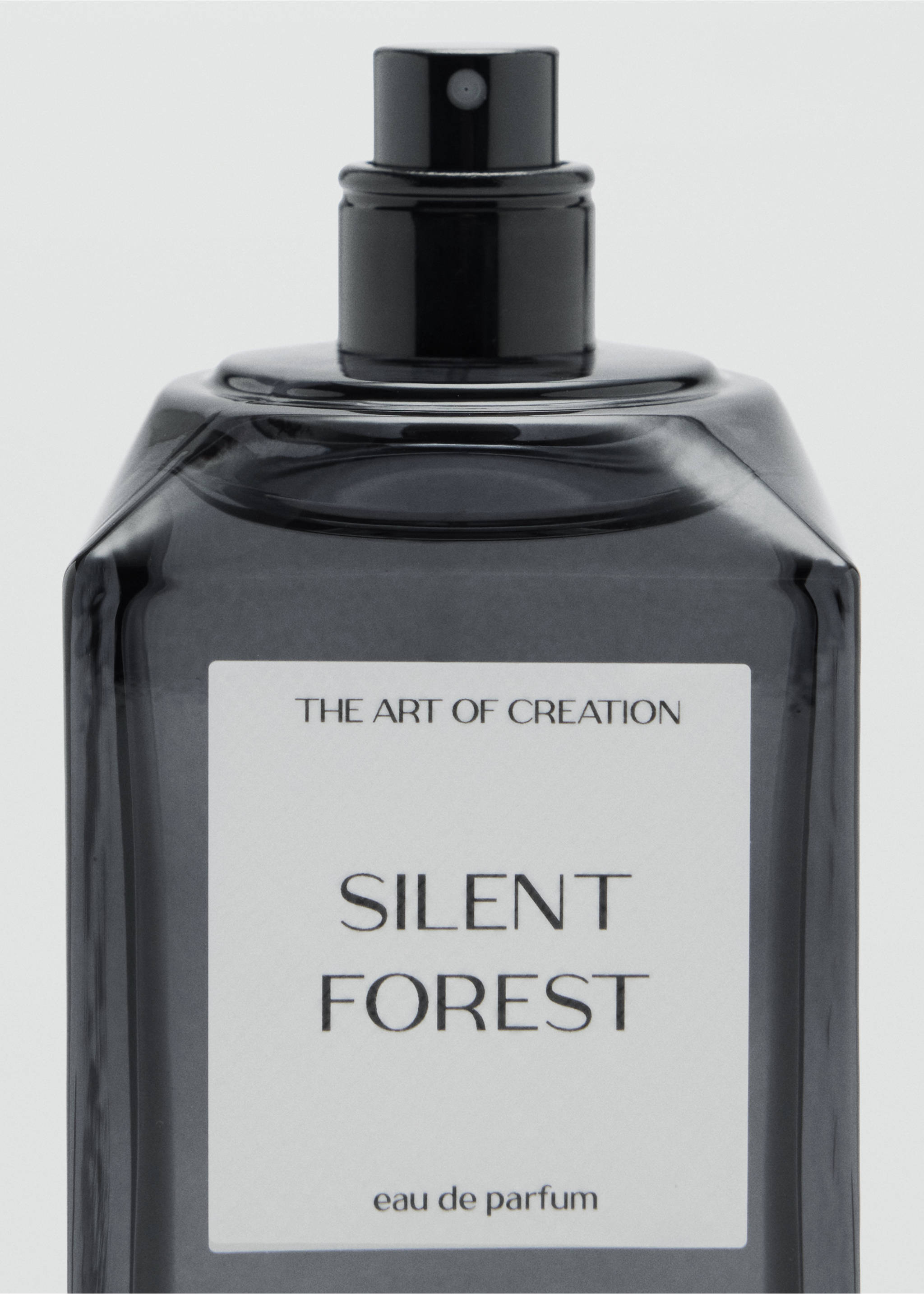 Smoked glass perfume bottle with a white label reading Silent Forest eau de parfum., Mink Grey. Ref: 47001446-00.