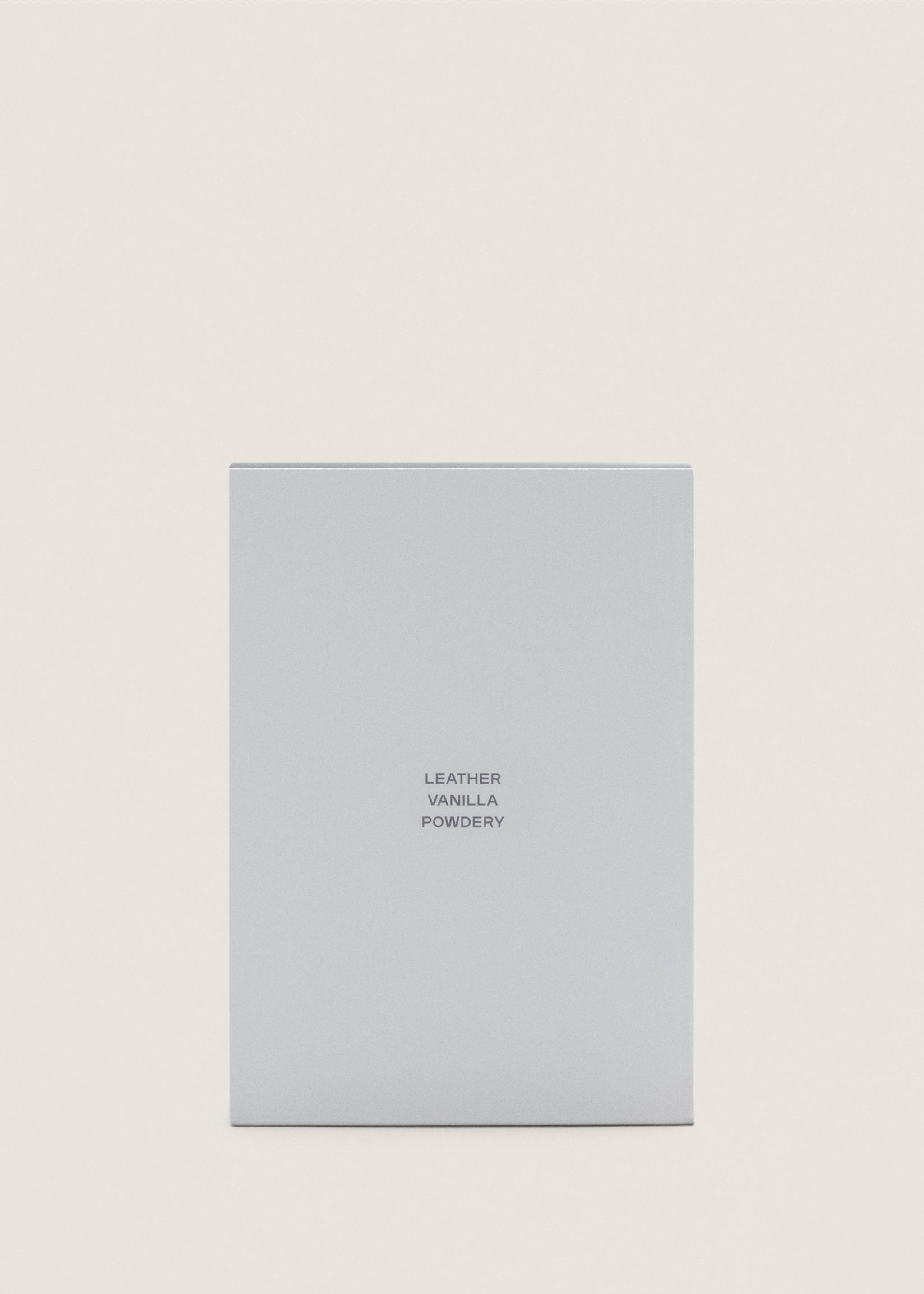 Close-up of a light grey perfume box with leather, vanilla and powdery text., Mink Grey. Ref: 47001453-00.