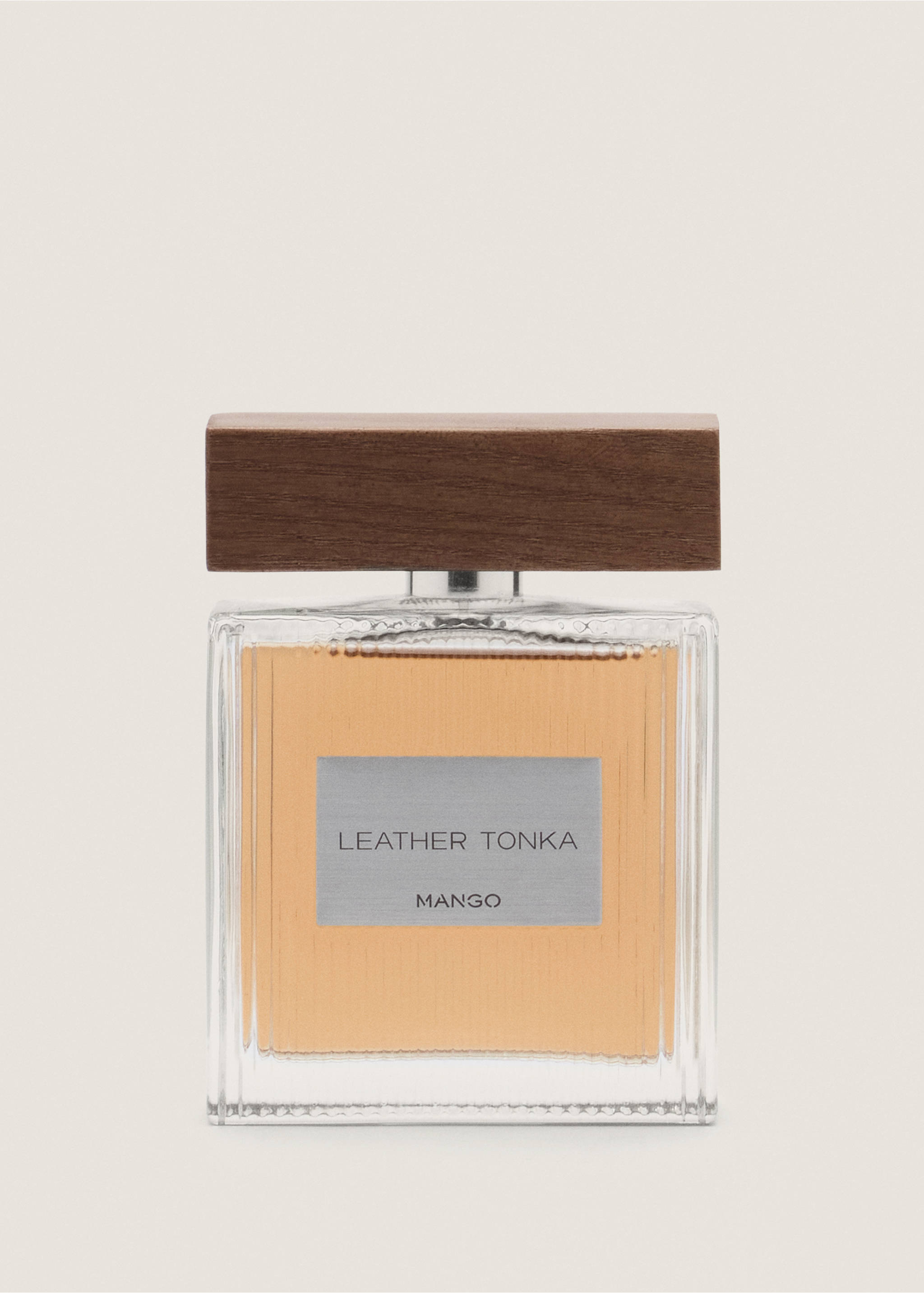 Perfume bottle with amber liquid, silver label, and dark wooden cap., Mink Grey. Ref: 47001453-00.