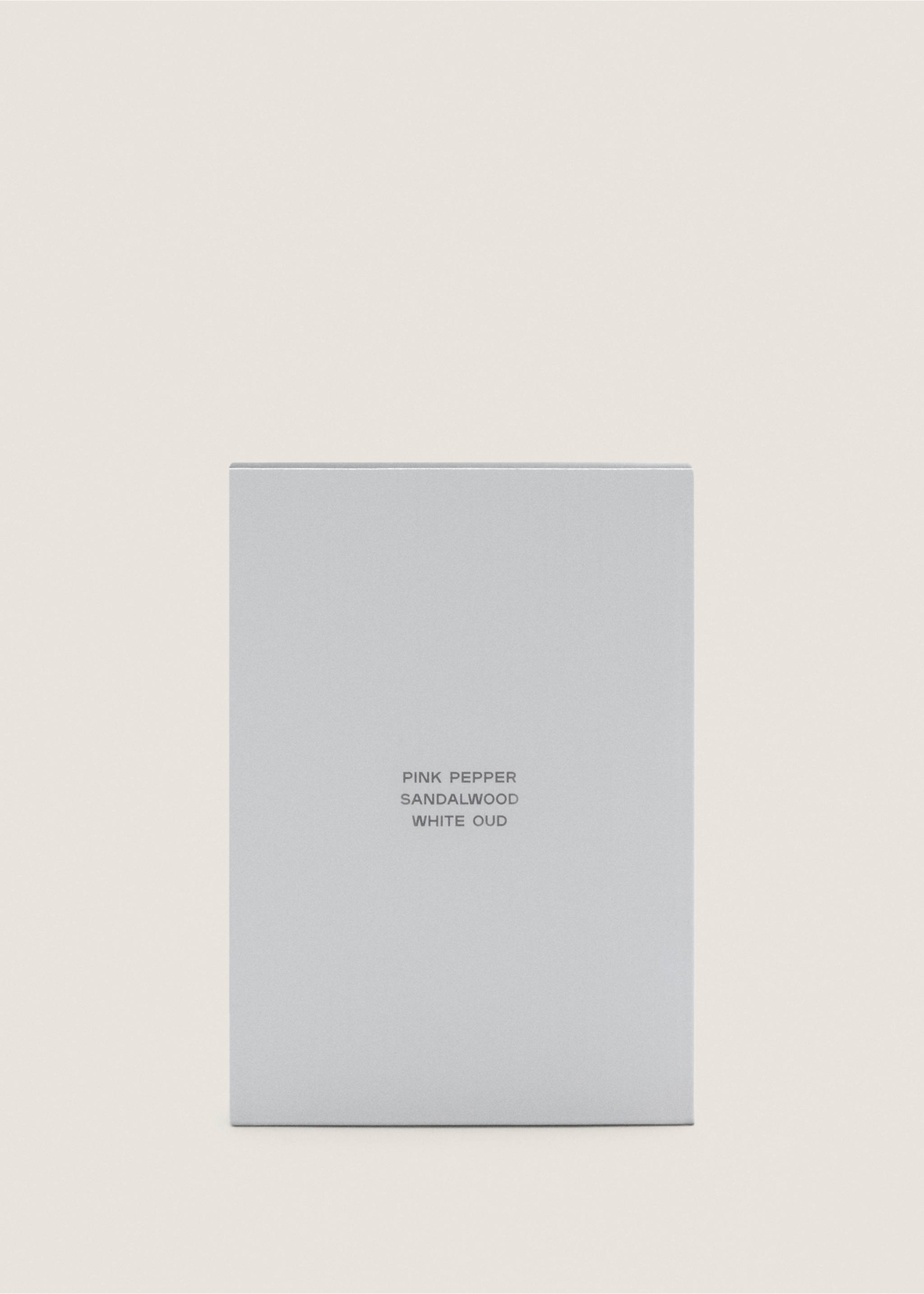 Close-up of a grey perfume box with pink pepper, sandalwood, and white oud text., Mink Grey. Ref: 47001454-00.