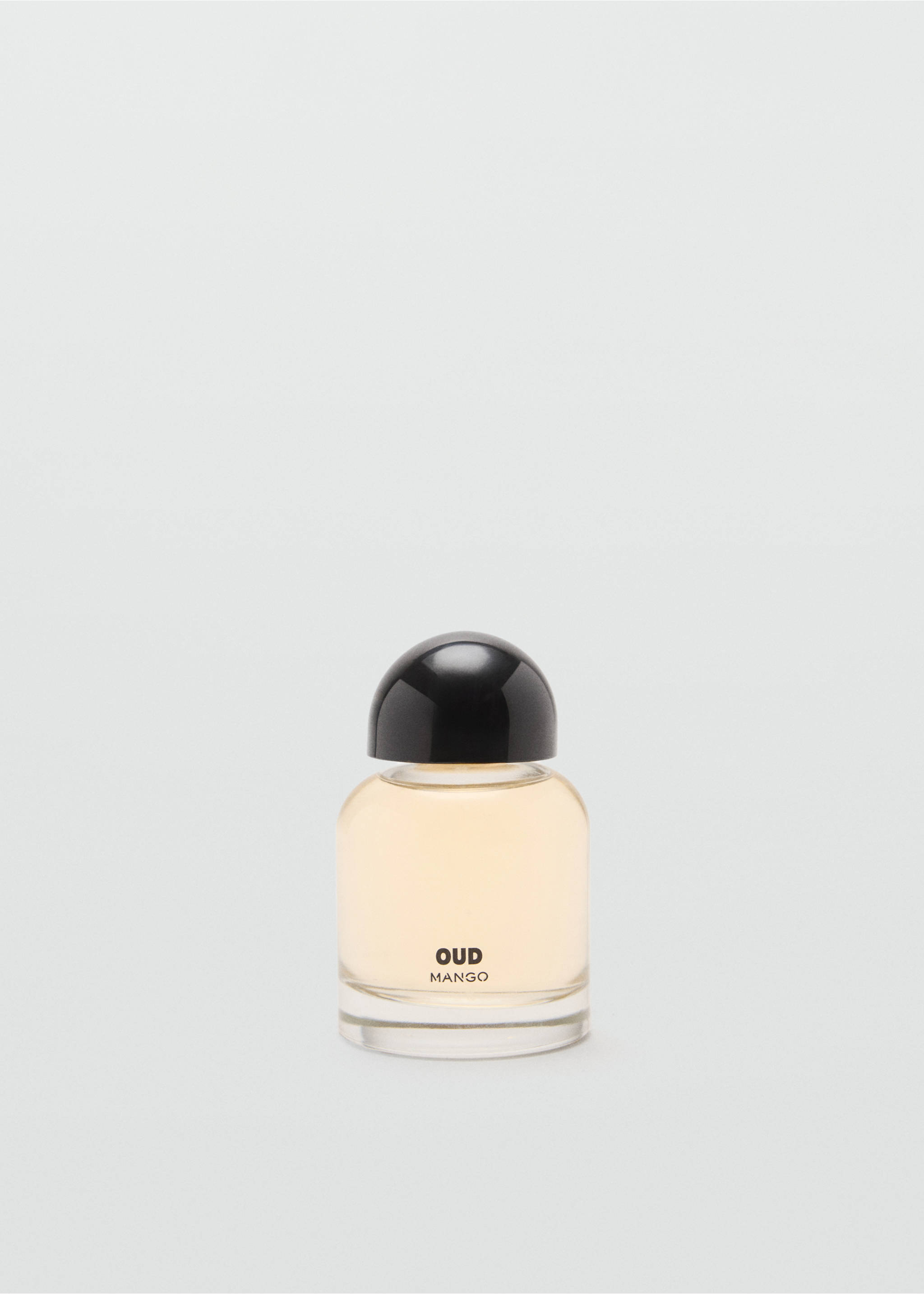Glass perfume bottle filled with amber fragrance, featuring a black cap and text on the front., Mink Grey. Ref: 47001457-00.
