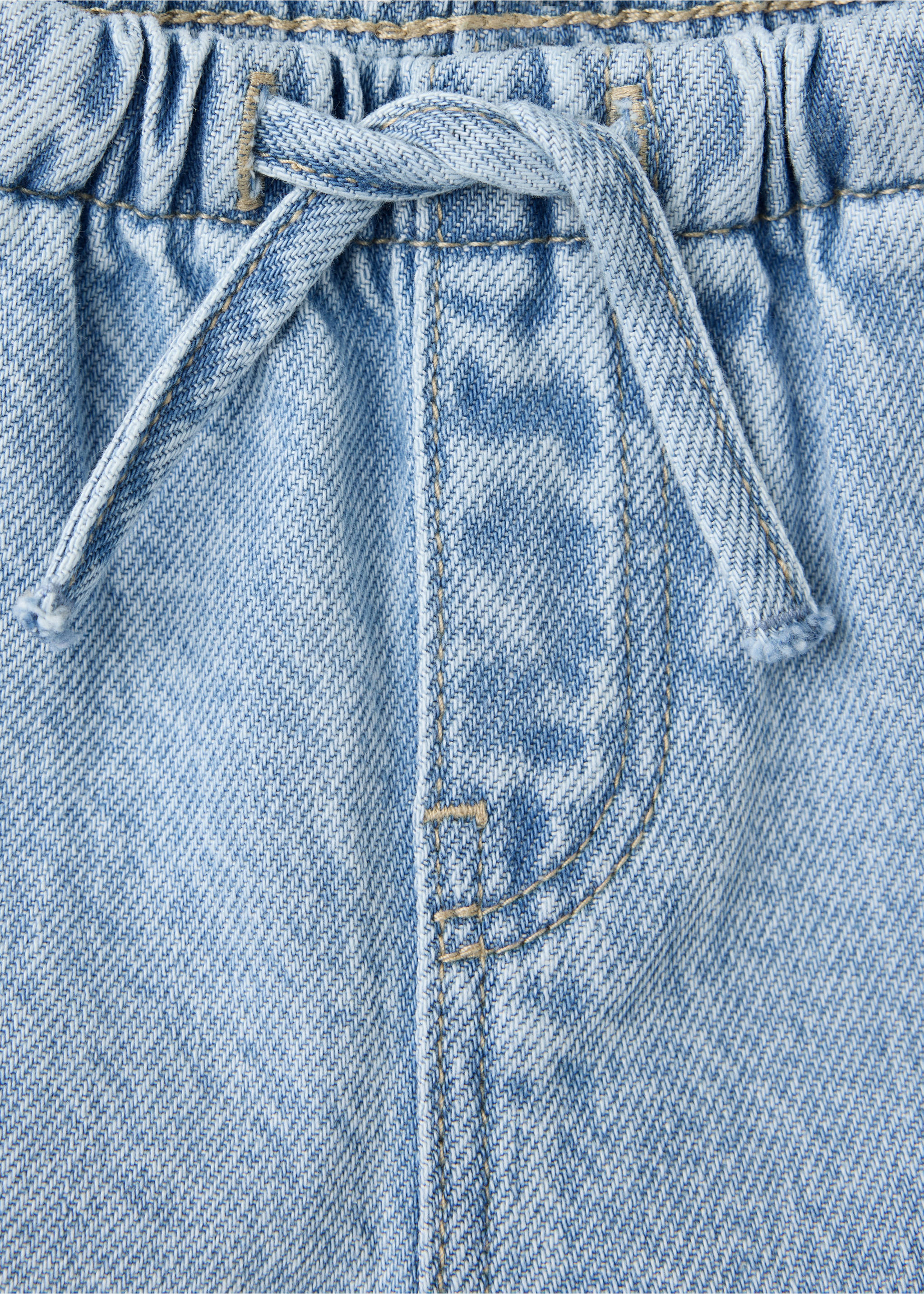 Close-up of light blue denim trousers with an elasticated waistband and drawstring., Medium Blue. Ref: 47011335-00.