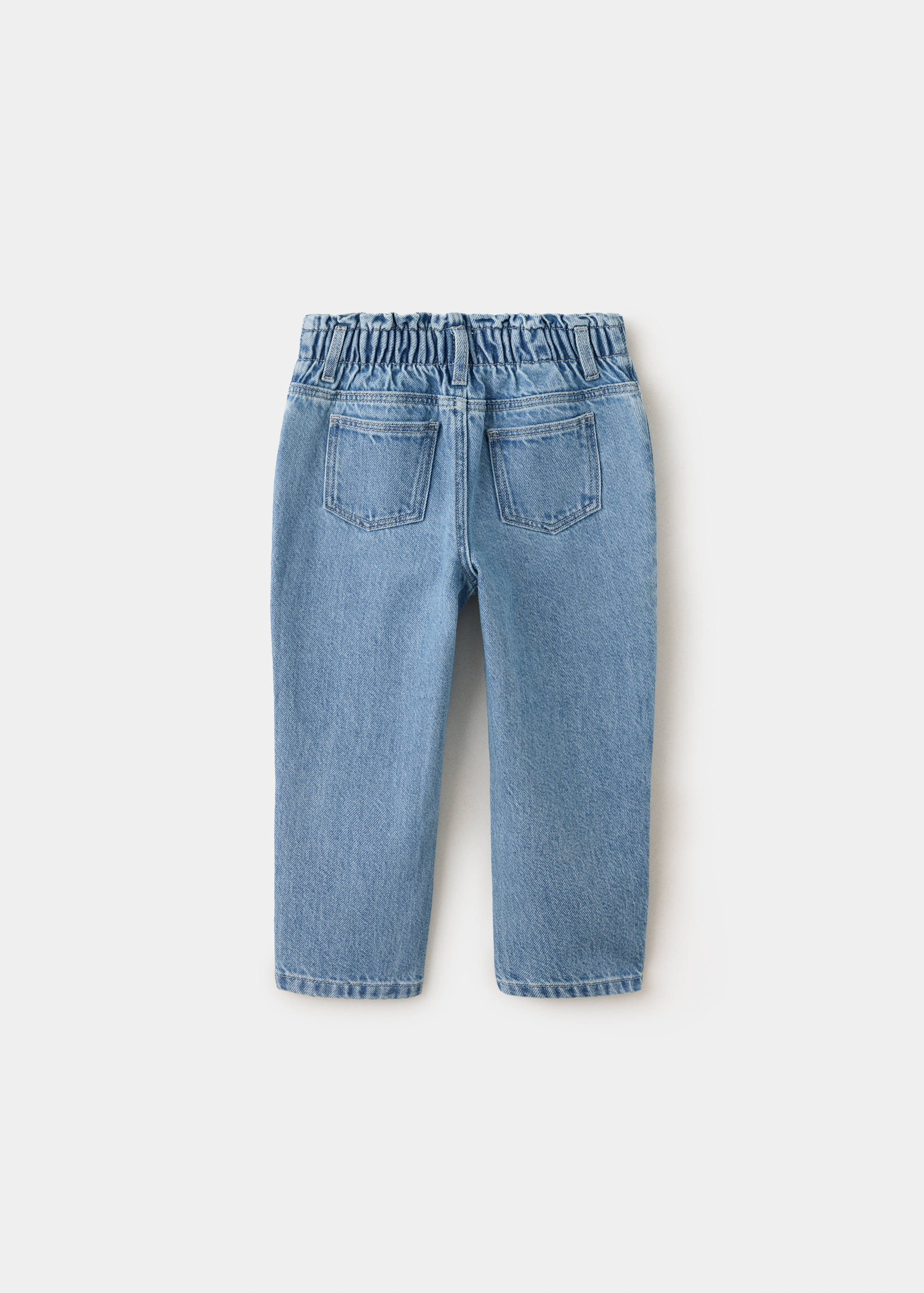 Blue denim trousers with a paperbag waist, back view.