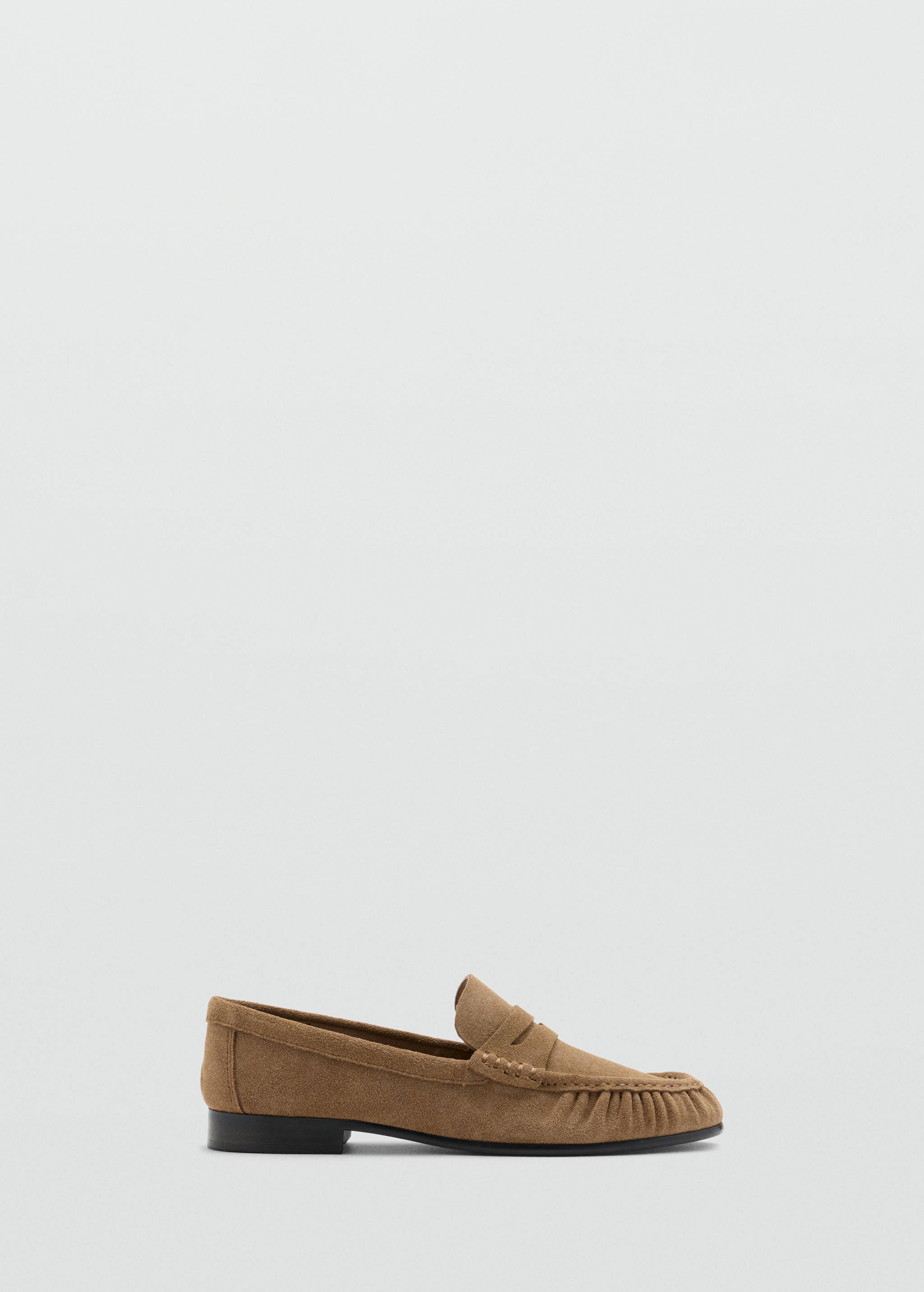 Brown suede loafer shoe with a low flat heel and moc-toe apron.