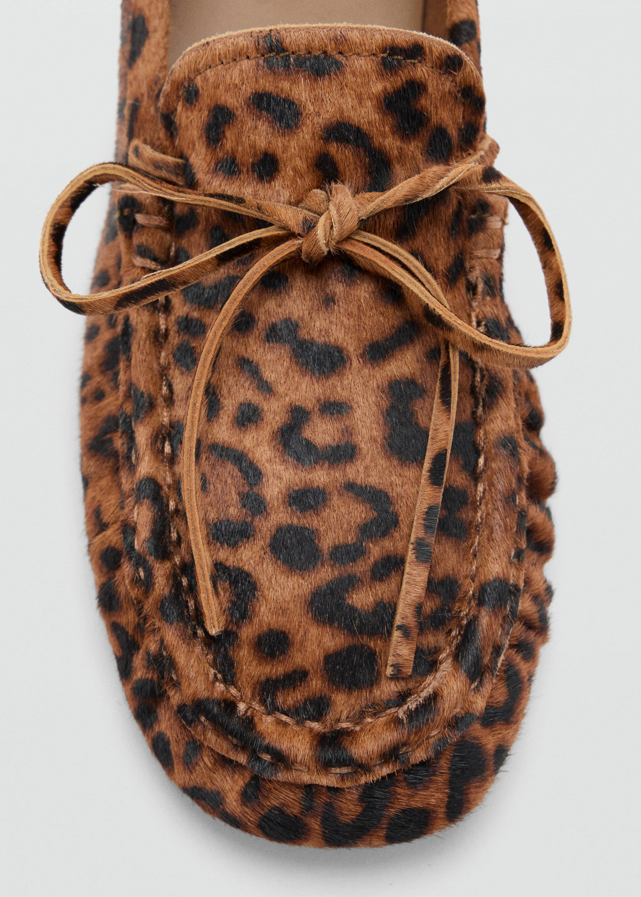 Leopard print faux-calf hair shoe detail with a leather bow.