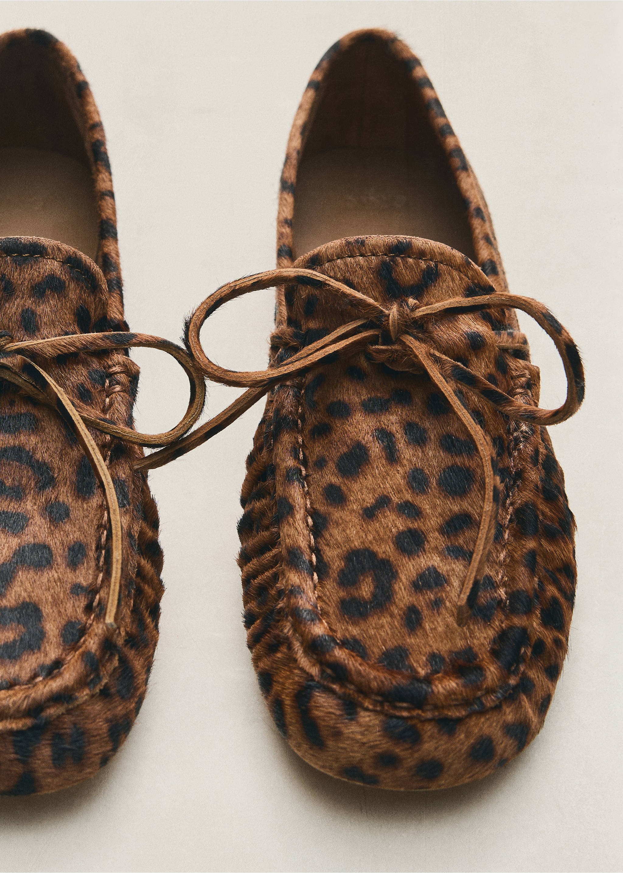 Leopard-print loafers with moccasin stitching and a front tie., Medium Brown. Ref: 47011345-00.